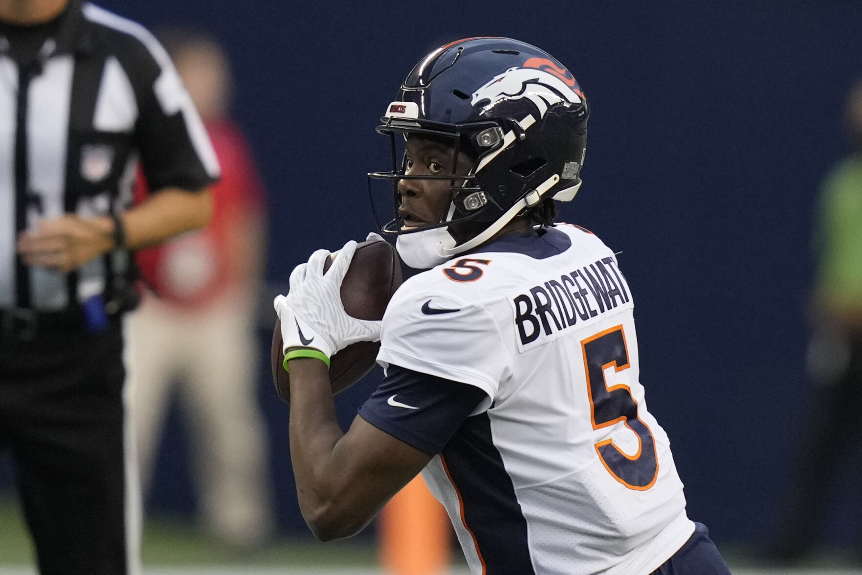 Denver Broncos quarterback Teddy Bridgewater (5) drops back to pass during the first half of the team's NFL preseason football game against the Seattle Seahawks, Saturday, Aug. 21, 2021, in Seattle. (AP Photo/Stephen Brashear)