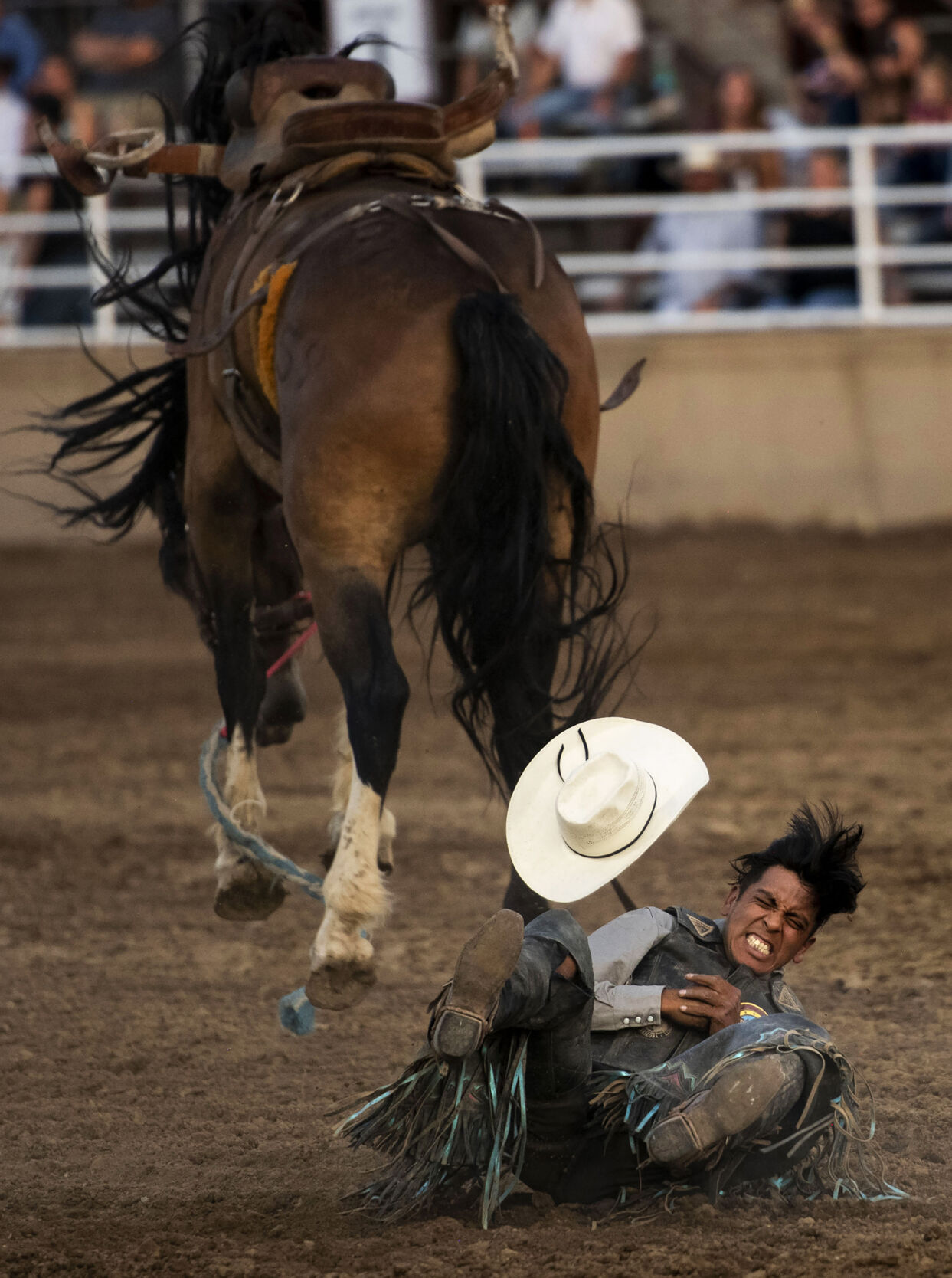The saddle bronc riding at the PRCA RAM Rodeo during the Colorado State Fair in Pueblo, Colo., on Friday, August 27, 2021. The fair kicked off on Friday and runs through Sept. 6. at the Colorado State Fairgrounds. (Chancey Bush/ The Gazette) (Chancey Bush/ The Gazette)