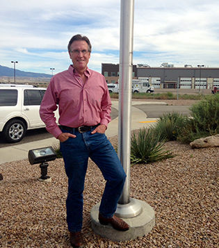 Mesa County Commissioner Scott McInnis stands in front of the Mesa County Animal Control building in Grand Junction during his weekly rounds checking in on county departments. (Photo by Nancy Lofholm, Colorado Politics)
