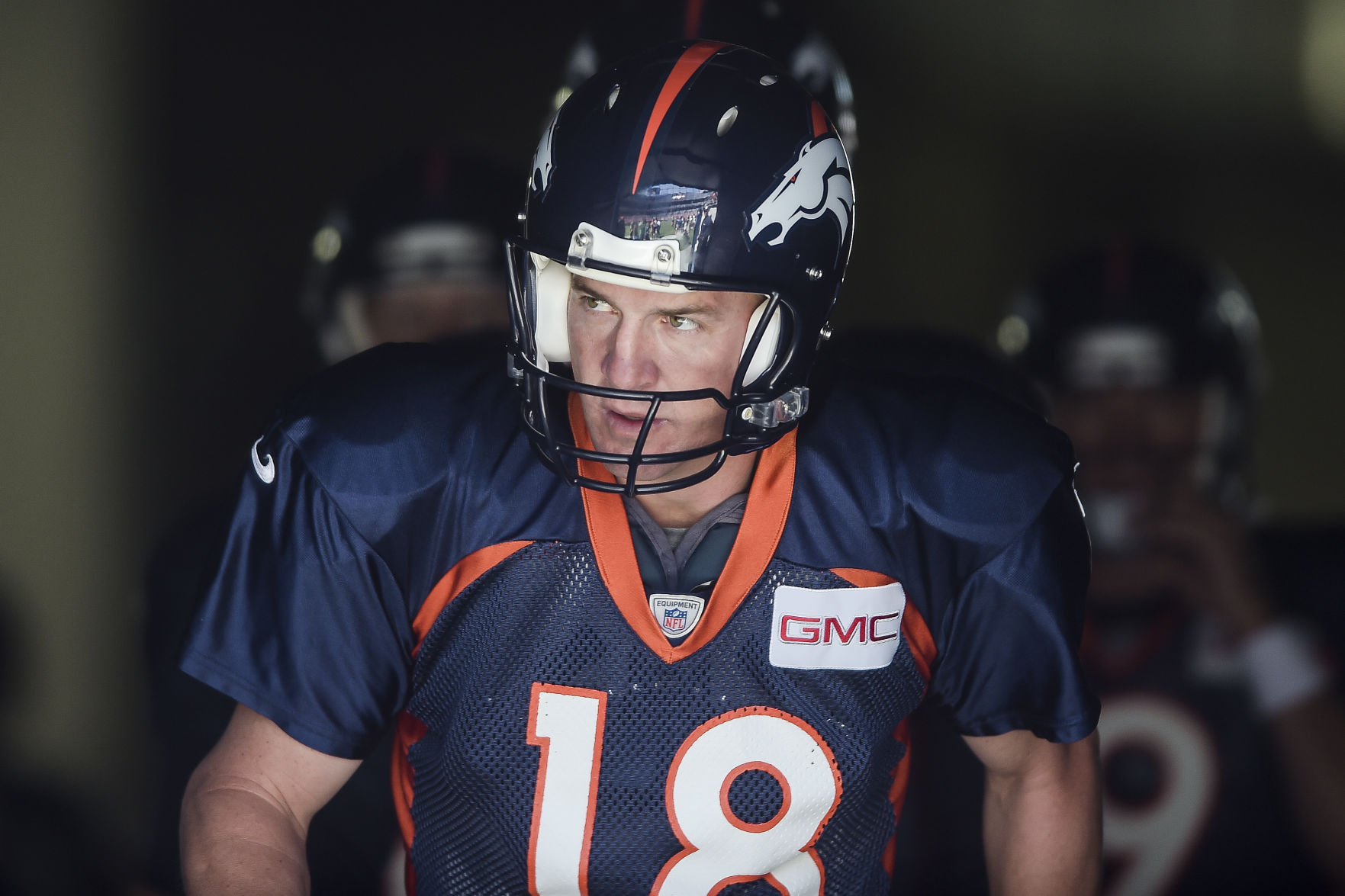 Denver Broncos quarterback Peyton Manning runs out of the tunnel before the Summer Scrimmage at Sports Authority Field at Mile High Friday, August 1, 2014. Michael Ciaglo, The Gazette (Michael Ciaglo, The Gazette)