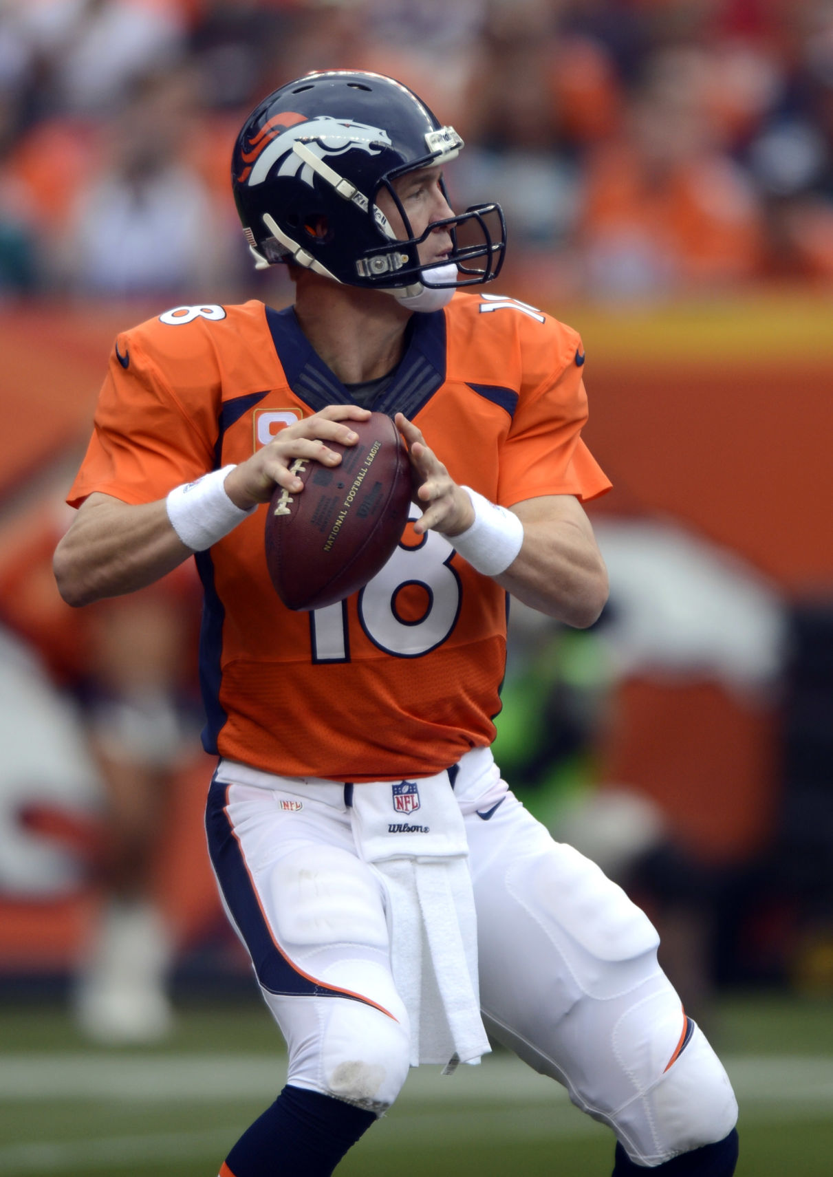 Broncos quarterback Peyton Manning drops back to throw in the second half of Denver's 52-20 win over the Eagles Sunday, September 29, 2013 at Sports Authority Field at Mile High. Photo by Mark Reis, The Gazette (MARK REIS)