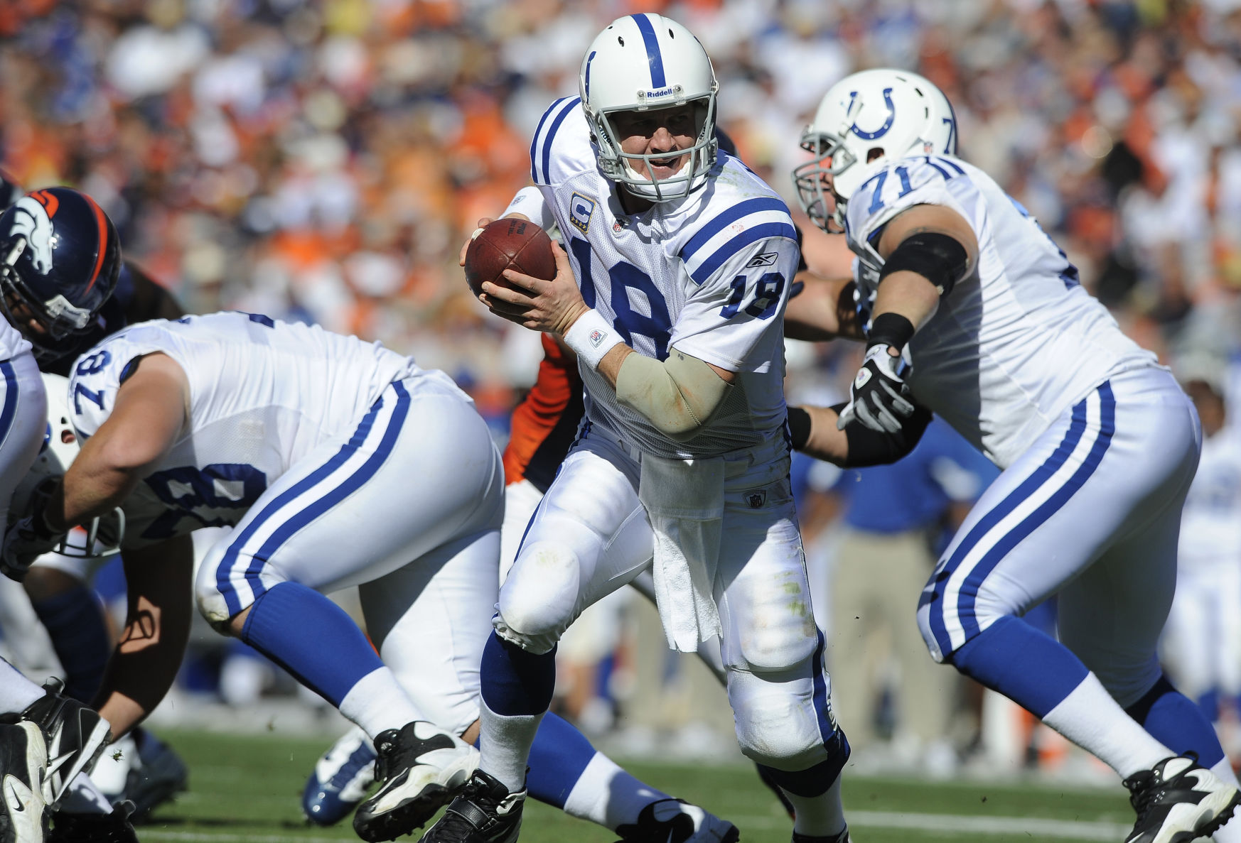 Colts quarterback Peyton Manning gets ready to pass off the ball. The Denver Broncos were beaten by the Indianapolis Colts 27-13 during a game at Invesco Stadium at Mile High on Sunday, Sept. 26, 2010. (The Gazette/Jerilee Bennett) (Jerilee Bennett)