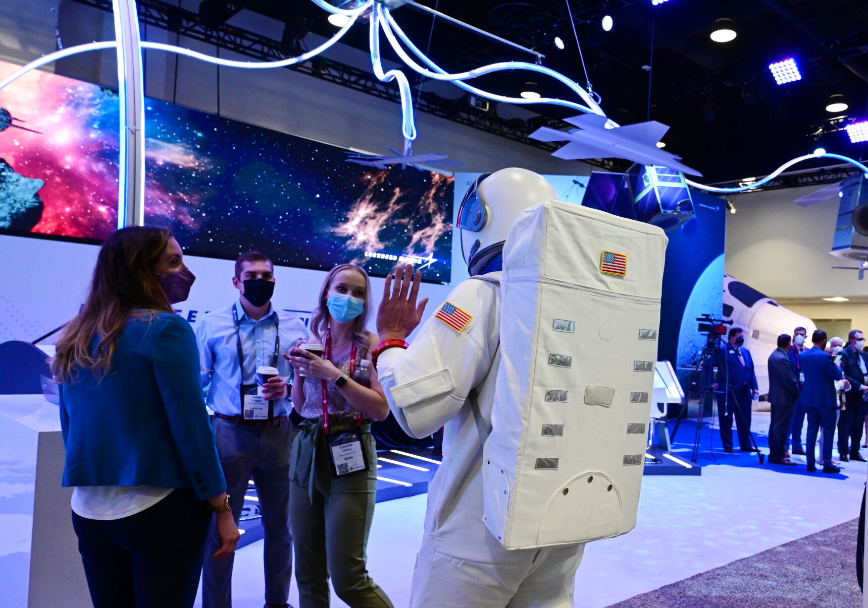 Dressed as an astronaut, Michael Ballantyne visits the Lockheed Martin exhibit at the Space Symposium on Tuesday, Aug. 24, 2021. (Photo by Jerilee Bennett, The Gazette) (JERILEE BENNETT THE GAZETTE)