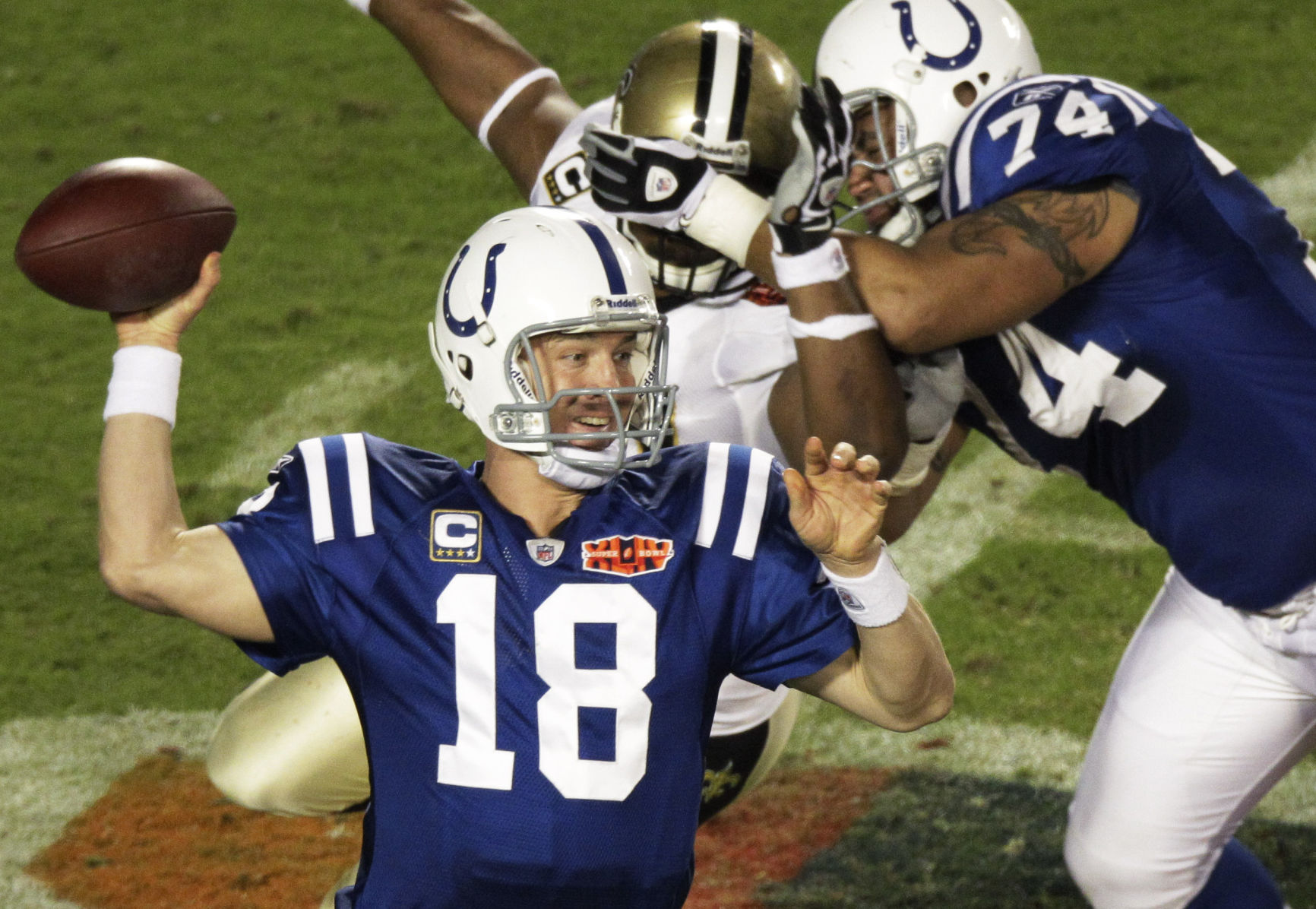Indianapolis Colts quarterback Peyton Manning (18) passes the ball against the New Orleans Saints during the second half of the NFL Super Bowl XLIV football game in Miami, Sunday, Feb. 7, 2010. (AP Photo/Charlie Riedel) (Charlie Riedel)