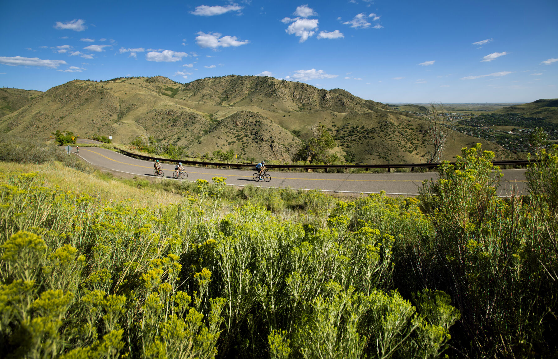 Cyclists climb the 4.57-mile road to the top of 7,377-foot Lookout Mountain Tuesday, Aug. 24, 2021, near Golden. The scenic byway was built in 1913. (Christian Murdock, The Gazette)