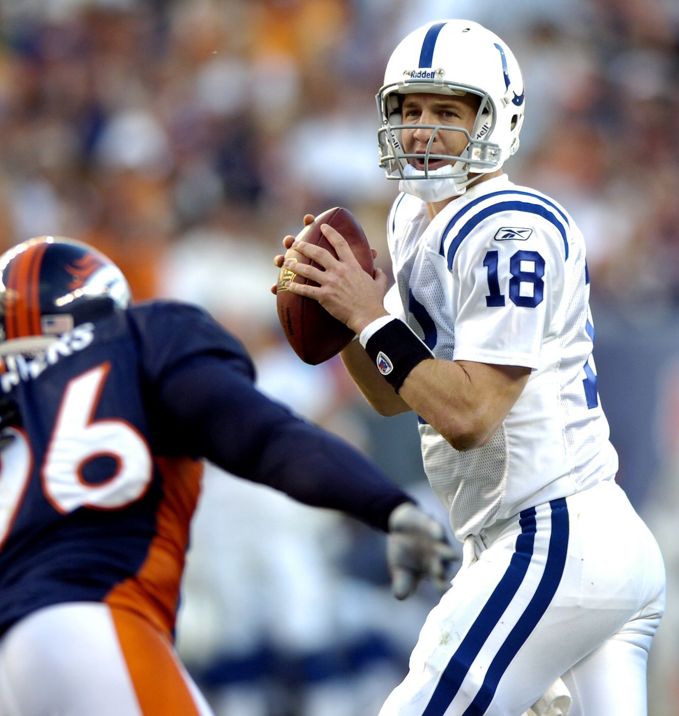 Indianapolis Colts quarterback Peyton Manning looks to pass during second half action at Invesco Field in Denver on Sunday, Oct. 29, 2006. Indianapolis defeated the Broncos 34-31. The Gazette, Bryan Oller (Bryan Oller)