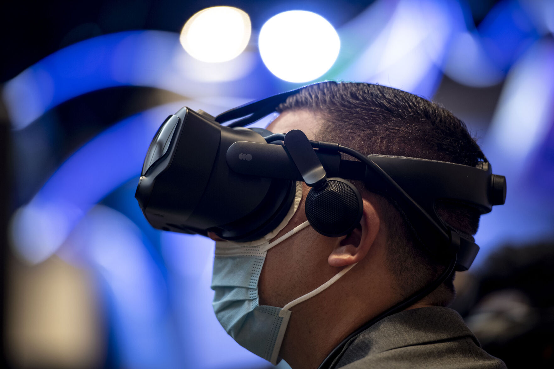 Jade Karpicke tries out virtual reality to see the concept of the Sierra Space Station at the Sierra Space exhibit during the 36th Space Symposium in Colorado Springs. (Chancey Bush, The Gazette)