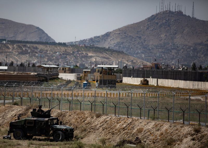 Paratroopers assigned to the 1st Brigade Combat Team, 82nd Airborne Division conduct security during evacuations from Hamid Karzai International Airport in Kabul, Afghanistan August 25, 2021. U.S. Central Command/Handout via REUTERS (US ARMY)