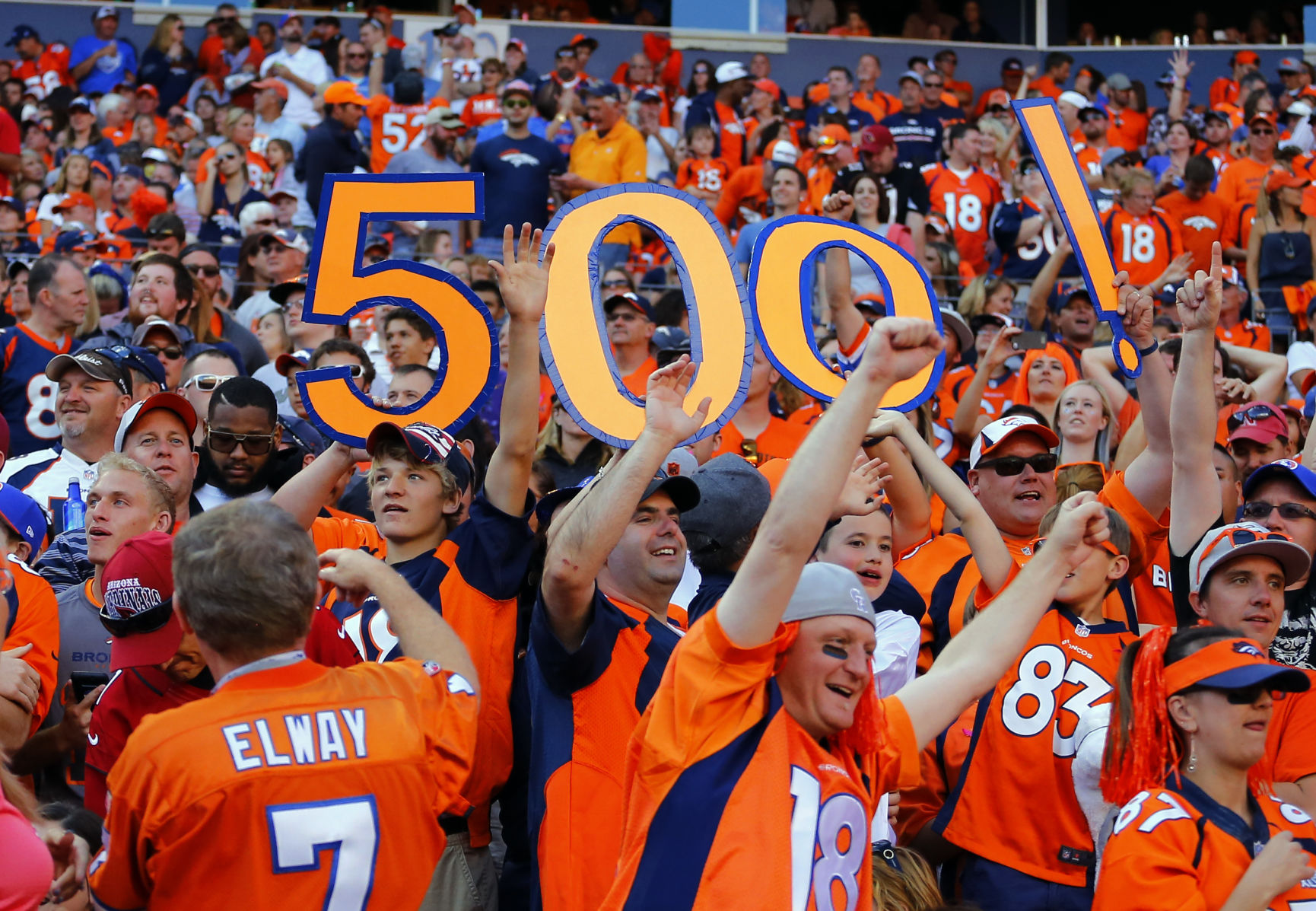 Denver Broncos fans display the number 500 after Peyton Manning threw his 500th career touchdown pass during an NFL football game between the Denver Broncos and the Arizona Cardinals, Sunday, Oct. 5, 2014, in Denver. (AP Photo/Jack Dempsey) (Jack Dempsey)