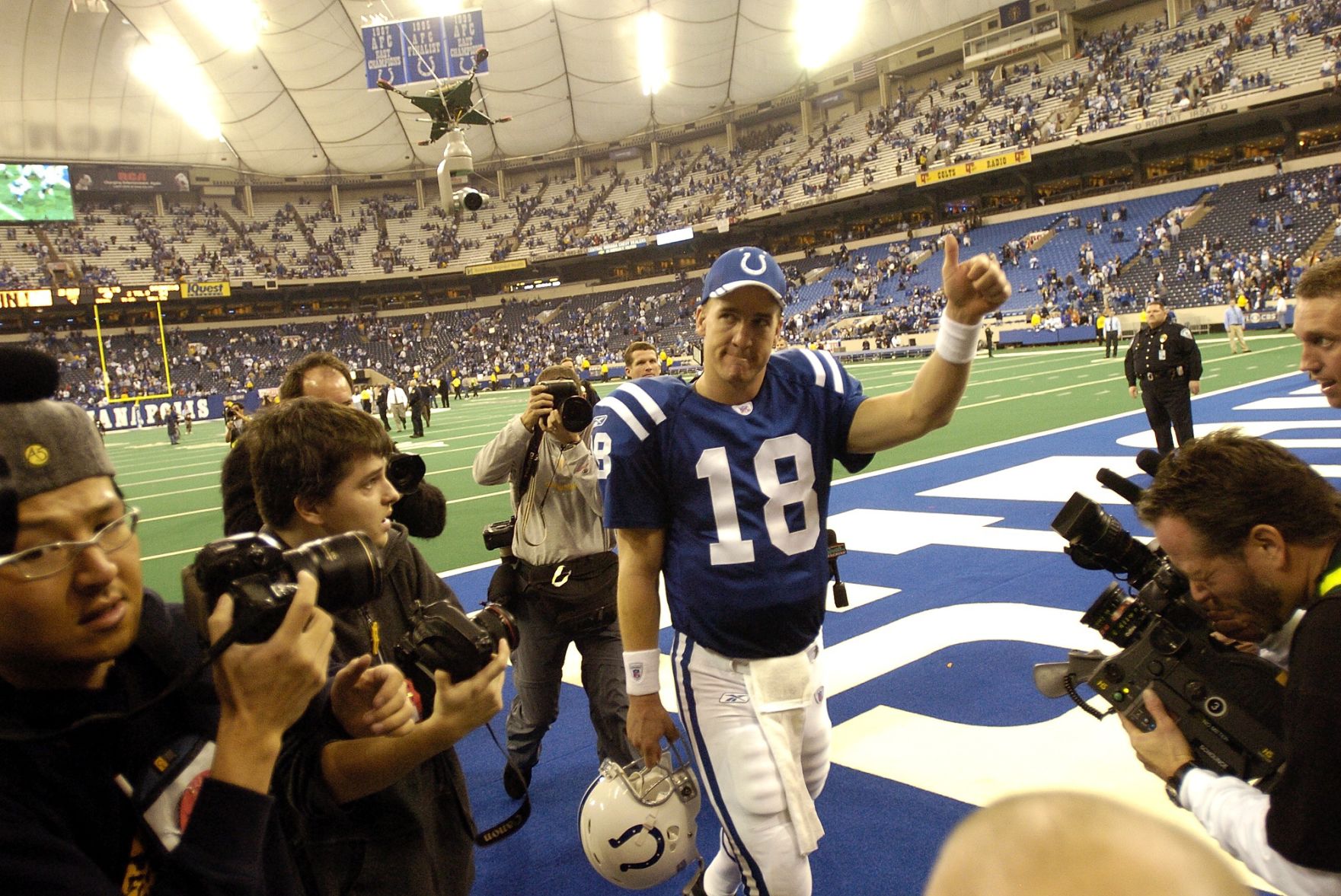 Colts quarterback Payton Manning gives a thumbs up to fans at the RCA Dome after beating the Broncos 49-24 in a AFC wild-card playoff game on Sunday, Jan. 9, 2005. Photo by David Bitton (David Bitton)