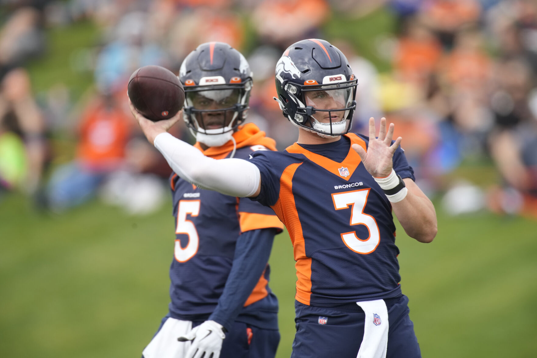 Broncos quarterbacks Drew Lock, right, and Teddy Bridgewater take part in drills July 31 in Englewood. (The Associated Press)