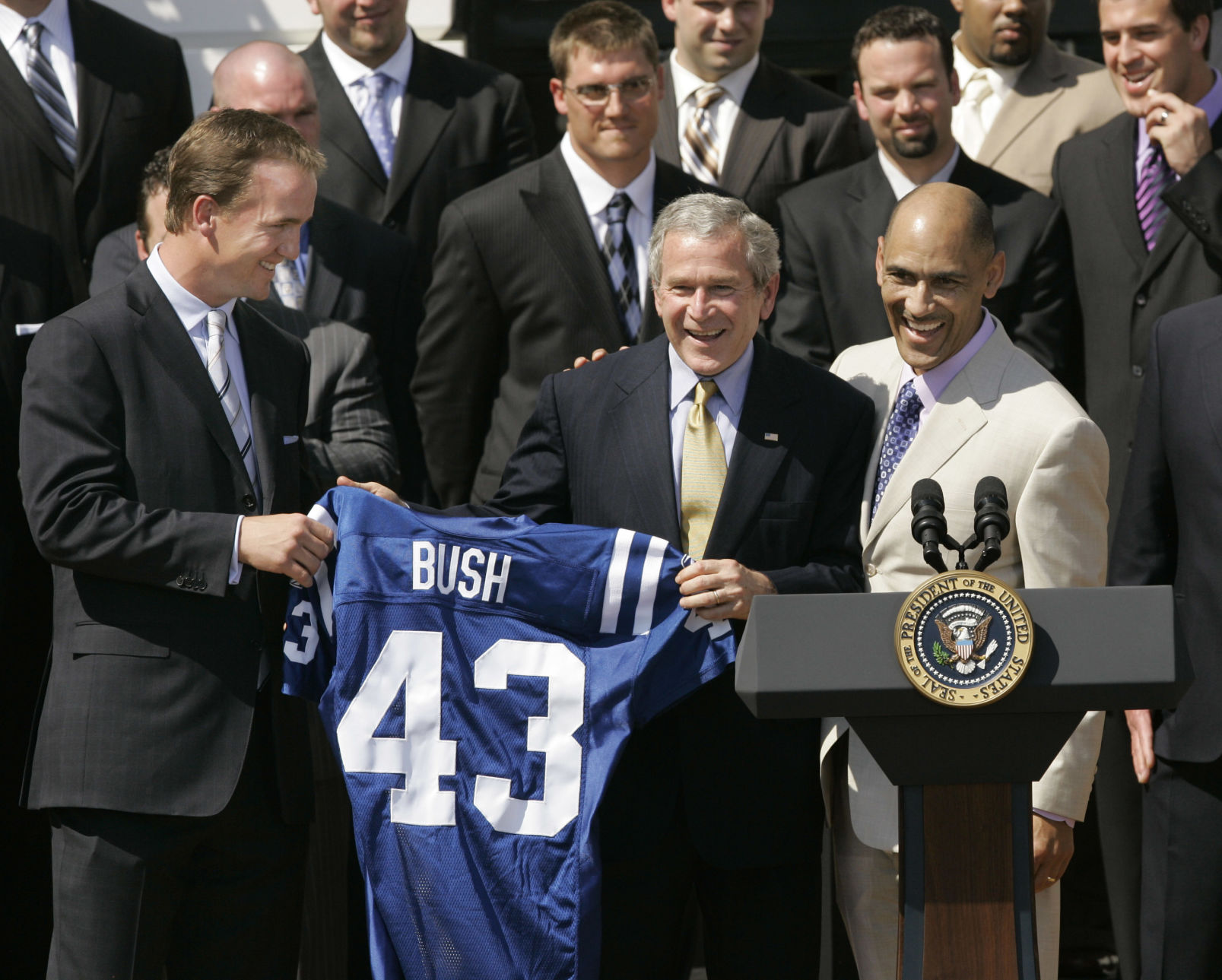 President Bush holds up a jersey with quarterback Peyton Manning, left, and head coach Tony Dungy during a ceremony honoring the NFL football Champions Indianapolis Colts on the South Lawn of the White House in Washington, Monday, April 23, 2007. (AP Photo/Gerald Herbert) (Gerald Herbert)