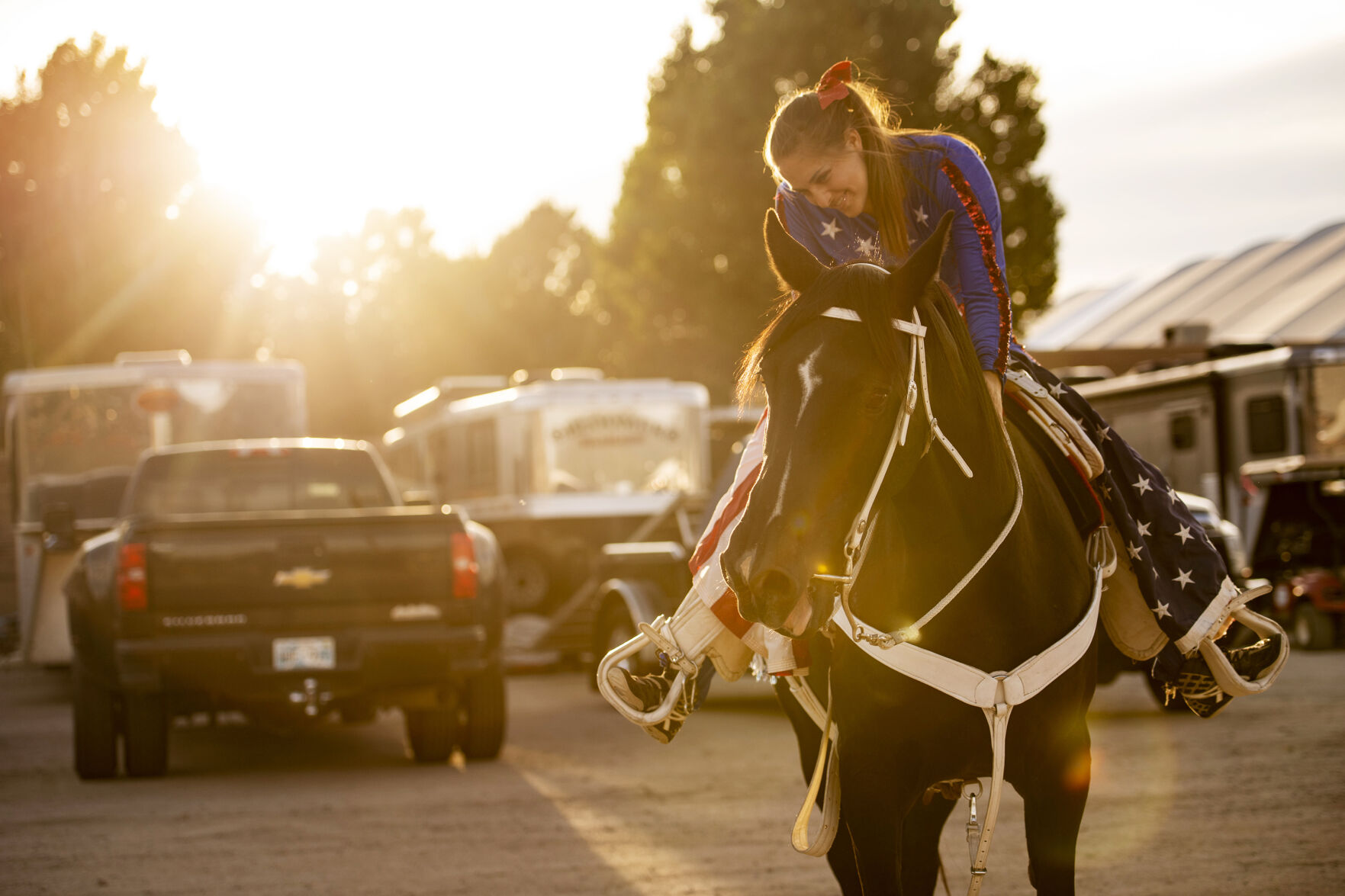 Lexi Shawcroft with her horse Whoops before the start of the PRCA RAM Rodeo during the Colorado State Fair in Pueblo, Colo., on Friday, August 27, 2021. The fair kicked off on Friday and runs through Sept. 6. at the Colorado State Fairgrounds. (Chancey Bush/ The Gazette) (Chancey Bush/ The Gazette)