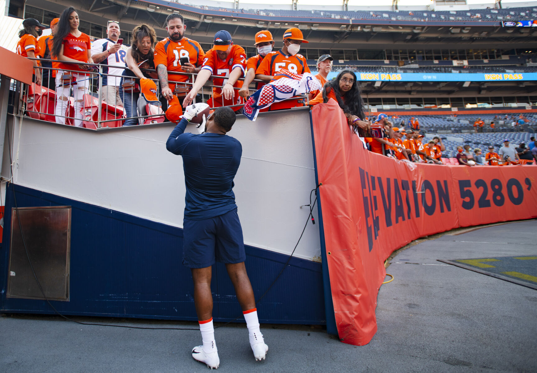 Denver Broncos linebacker Malik Reed (59) signs autographs for fans before the start of the Broncos preseason game against the Los Angeles Rams Saturday, Aug. 28, 2021, at Empower Field at Mile High in Denver. (The Gazette, Christian Murdock) (Christian Murdock/The Gazette)