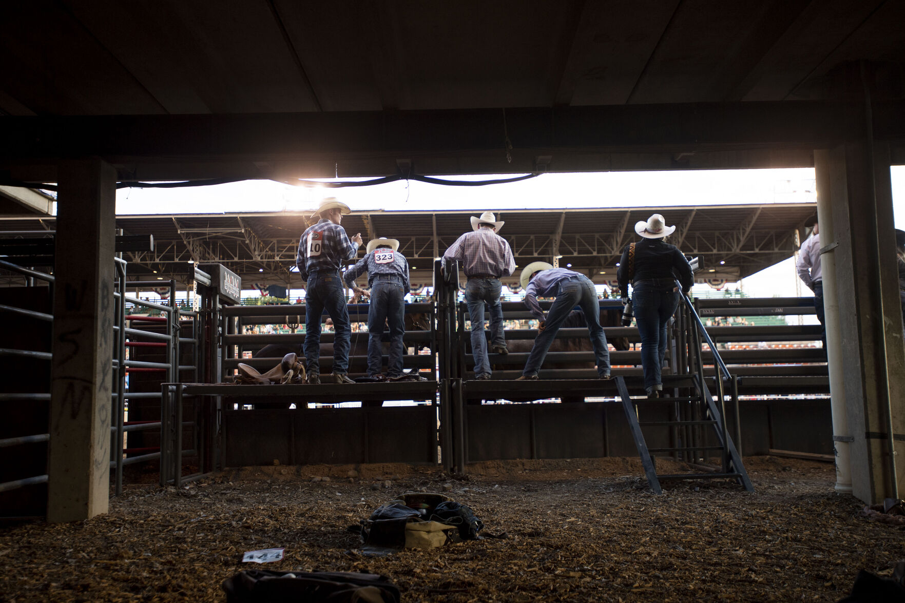 Cowboys prepare for the saddle bronc riding at the PRCA RAM Rodeo during the Colorado State Fair in Pueblo, Colo., on Friday, August 27, 2021. The fair kicked off on Friday and runs through Sept. 6. at the Colorado State Fairgrounds. (Chancey Bush/ The Gazette) (Chancey Bush/ The Gazette)