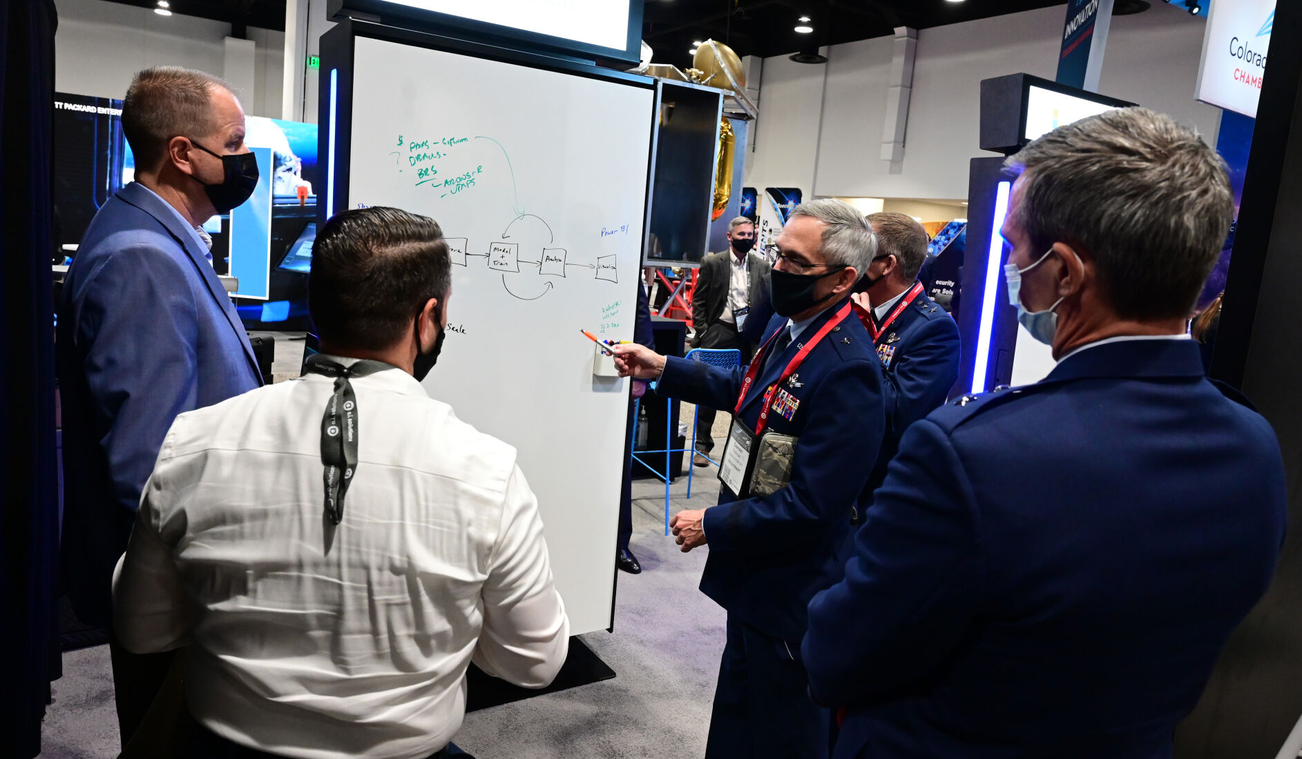 Brigadier Gen. Damon Feltman speaks with attendees at the Space Symposium at the Microsoft exhibit on Tuesday, Aug. 24, 2021. (Photo by Jerilee Bennett, The Gazette) (JERILEE BENNETT THE GAZETTE)