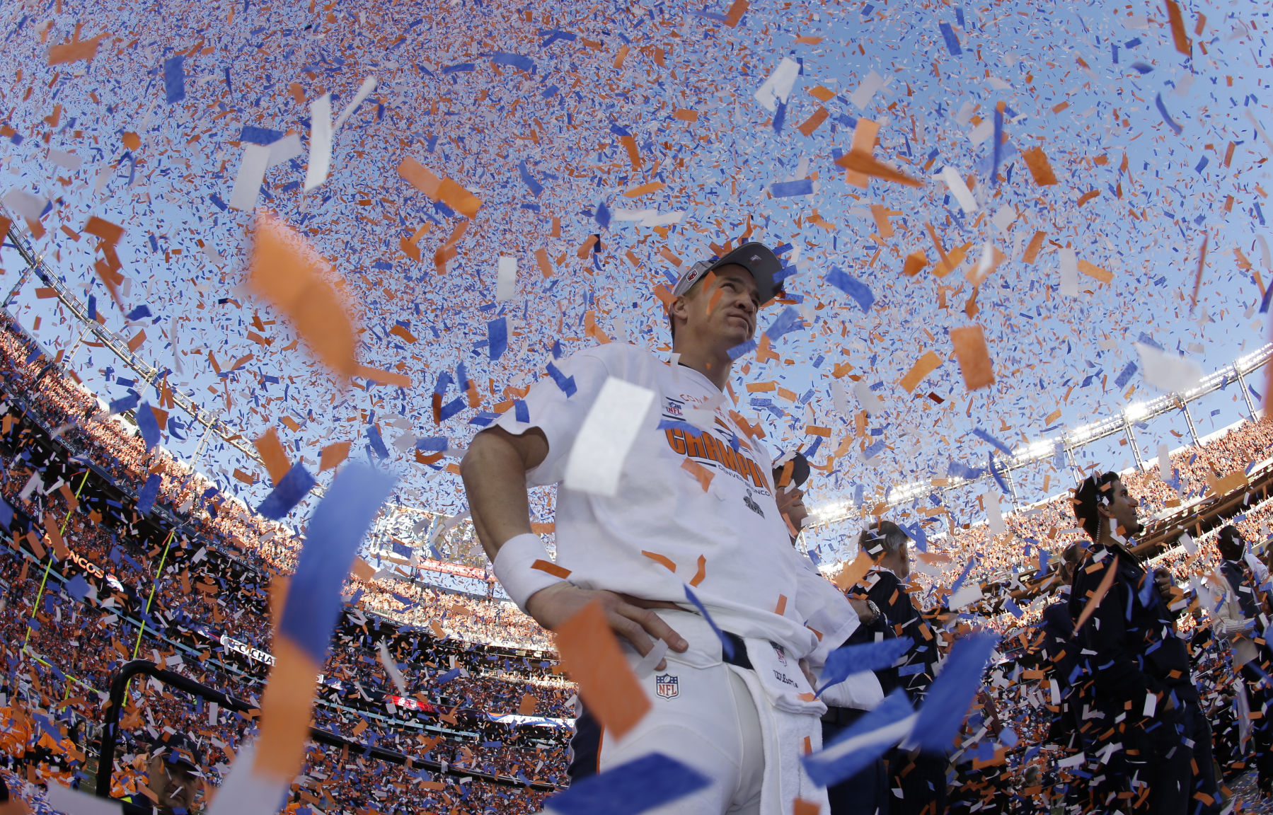 Denver Broncos quarterback Peyton Manning is engulfed in confetti during the trophy ceremony after the AFC Championship NFL playoff football game in Denver, Sunday, Jan. 19, 2014. The Broncos defeated the Patriots 26-16 to advance to the Super Bowl. (AP Photo/Charlie Riedel) (Charlie Riedel)