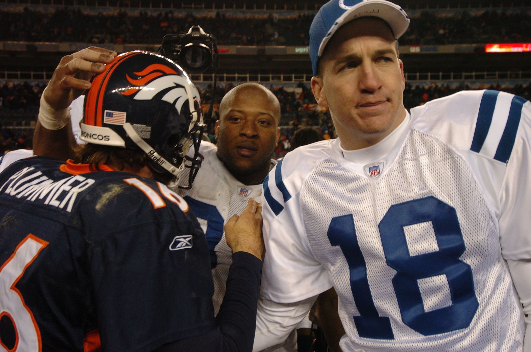 Bronco quarterback Jake Plummer and Indianapolis quarterback Peyton Manning greet each other following the Broncos' 33-14 win Sunday, January 2, 2005 at Invesco Field at Mile High. Mark Reis photo (MARK REIS)
