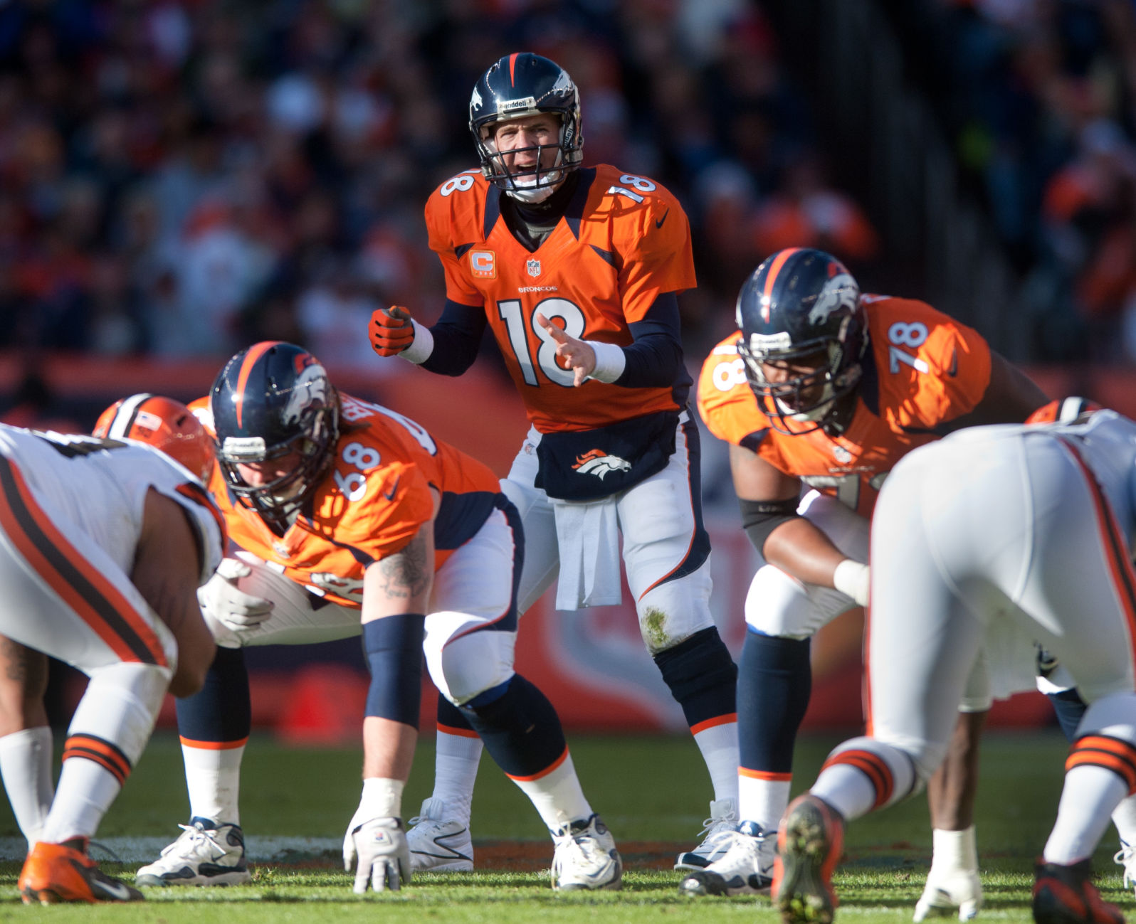 Broncos quarterback Peyton Manning barks commands at the line of scrimmage in the second quarter of Denver's 34-12 win Sunday, December 23, 2012 at Sports Authority Field at Mile High. Photo by Mark Reis, The Gazette (MARK REIS, THE GAZETTE)