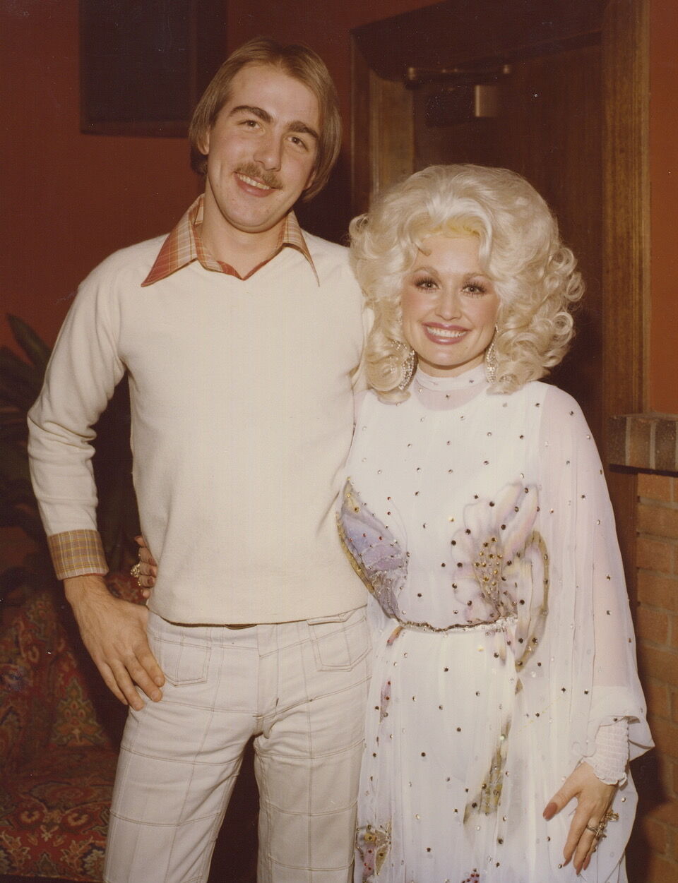 Denver Post music writer G. Brown, left, and Dolly Partonin 1977. (Courtesy photos)