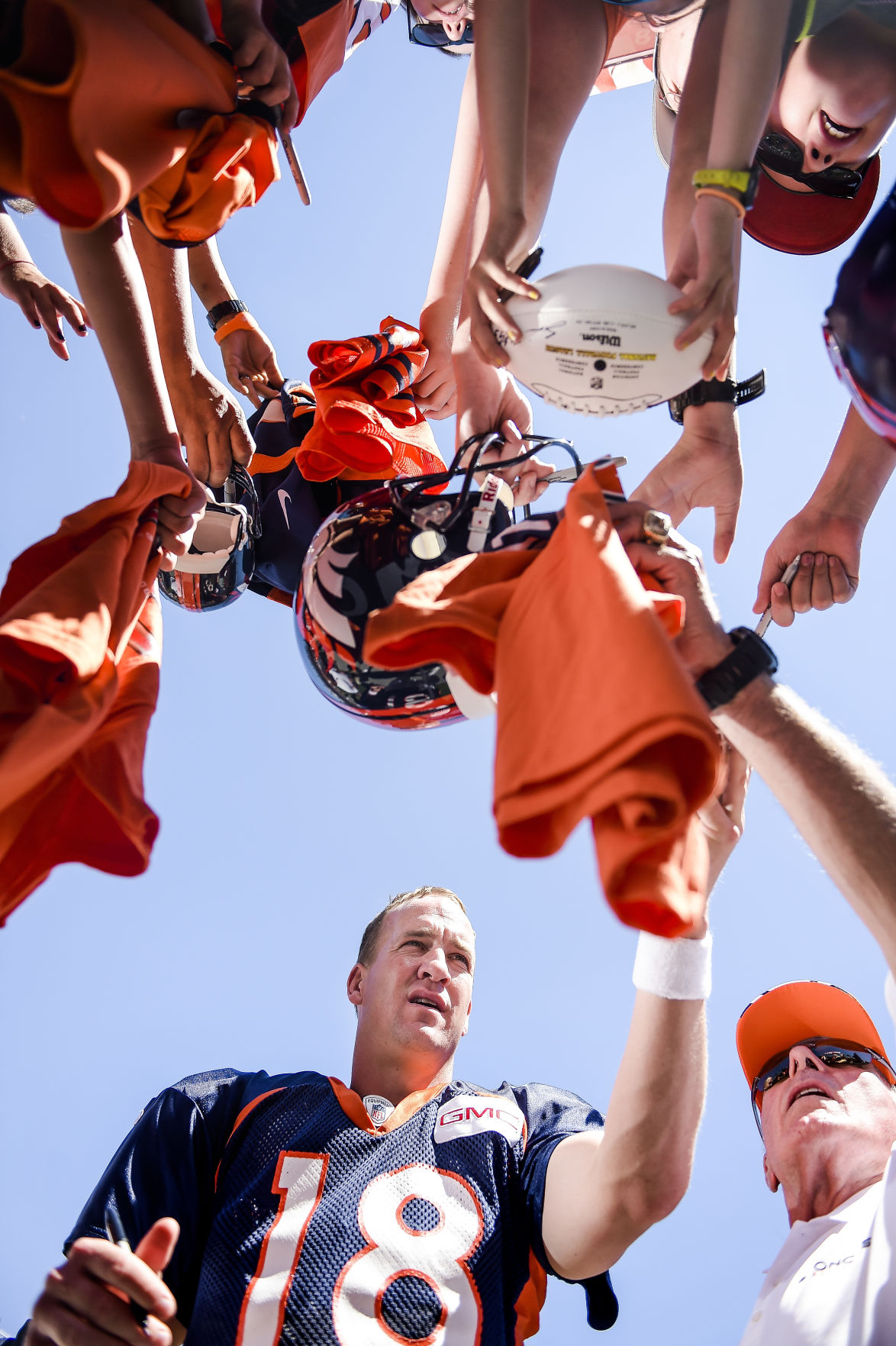 Denver Broncos quarterback Peyton Manning signs autographs after the Summer Scrimmage at Sports Authority Field at Mile High Friday, August 1, 2014. Michael Ciaglo, The Gazette (Michael Ciaglo, The Gazette)