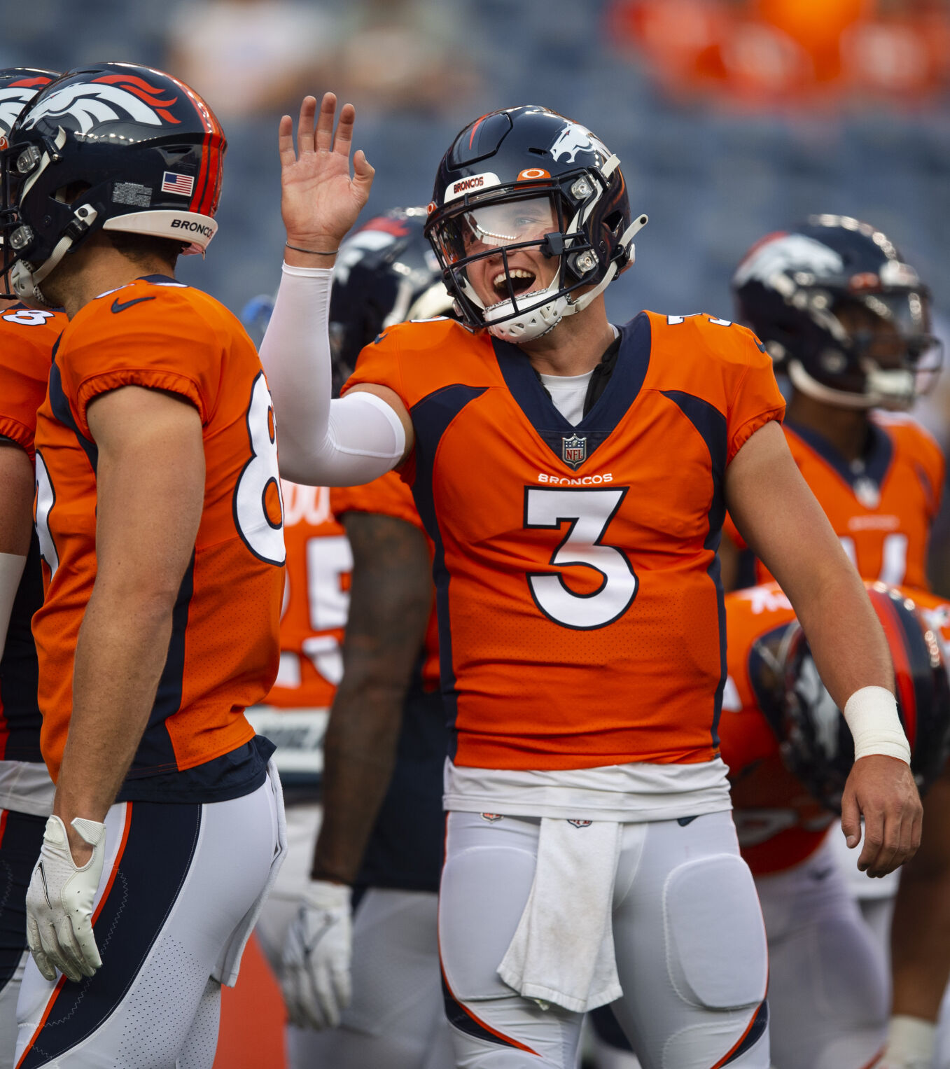Broncos quarterback Drew Lock jokes with teammates during warmups Aug. 28 before a preseason game in Denver. (Christian Murdock, The Gazette)