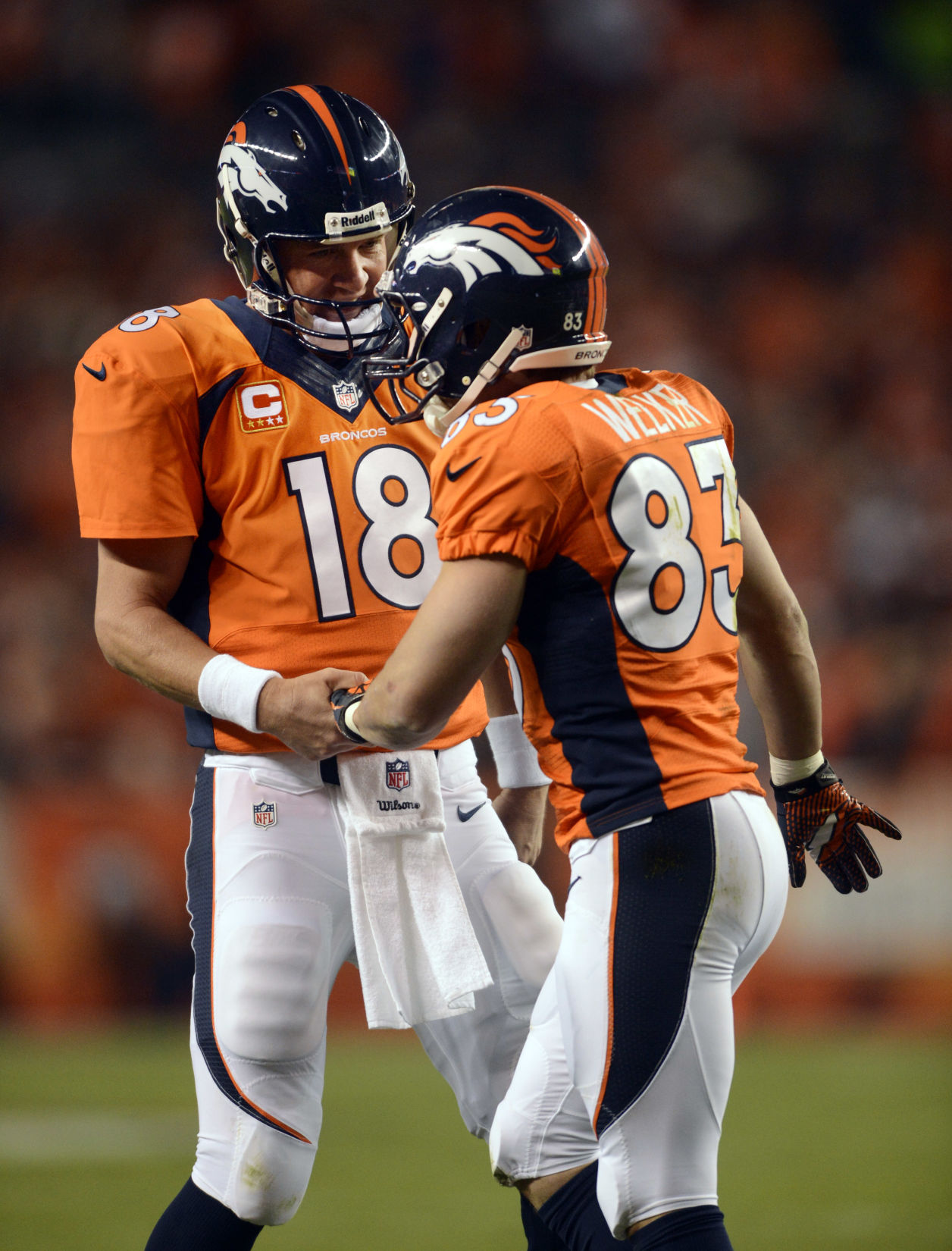 Denver Broncos quarterback Peyton Manning (18) congratulates wide receiver Wes Welker (83) after they connected on a second quarter touchdown against the Raiders Monday night, September 23, 2013 at Sports Authority Field at Mile High. Photo by Mark Reis, The Gazette (MARK REIS)