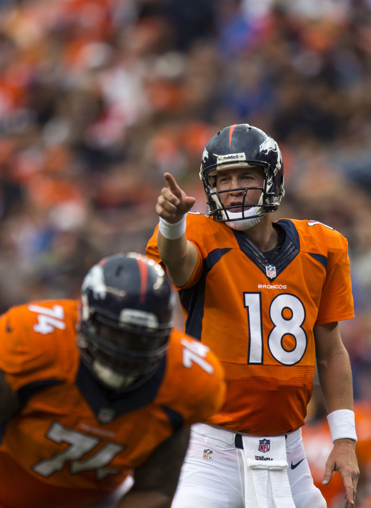 Denver Broncos quarterback Peyton Manning (18) gestures during a preseason game against the St. Louis Rams on Saturday, August 24, 2013 at Sports Authority Field at Mile High Stadium in Denver, CO. Photo by: Kent Nishimura, The Gazette (KENT NISHIMURA, THE GAZETTE)