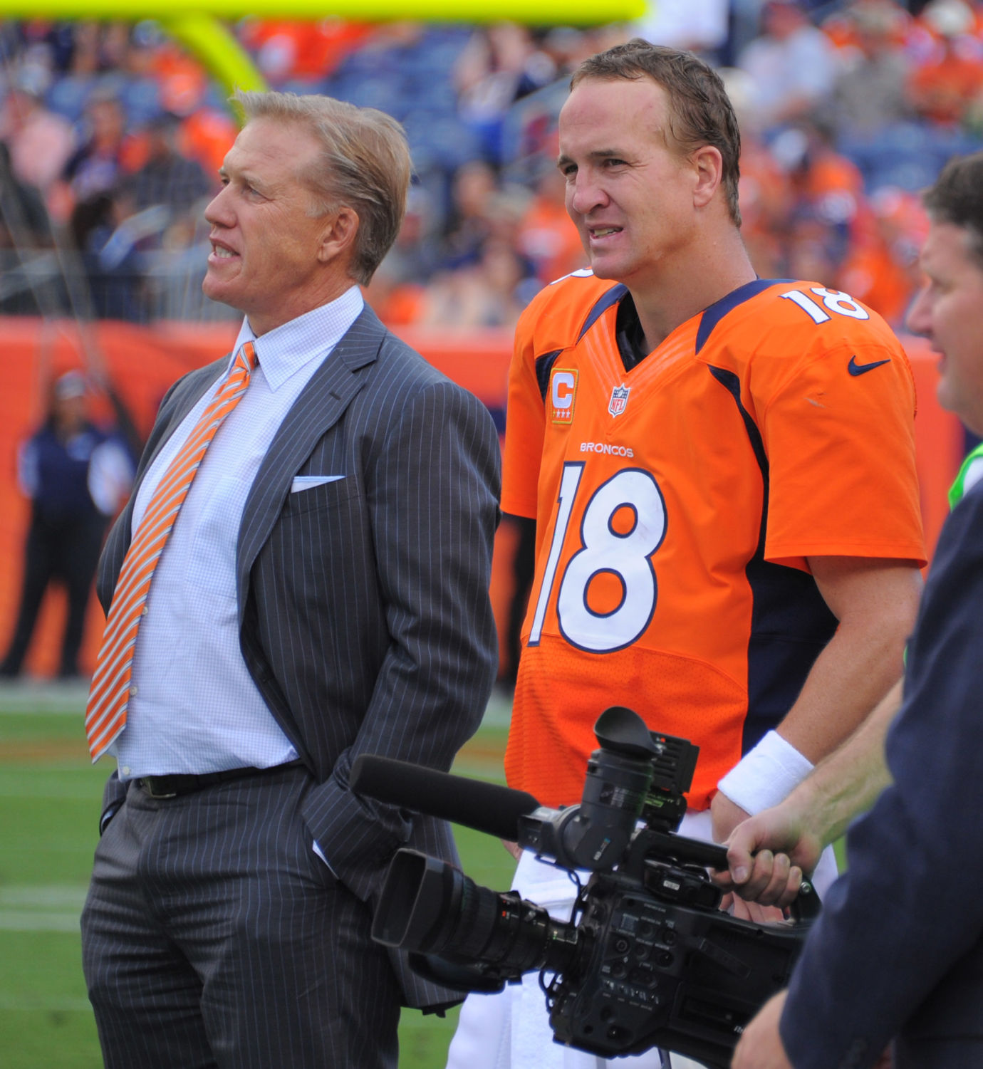 John Elway and Peyton Manning stand together in the closing minutes of Denver's 37-6 win over the Raiders Sunday, September 30, 2012 at Sports Authority Field at Mile High. Photo by Mark Reis, The Gazette (MARK REIS, THE GAZETTE)
