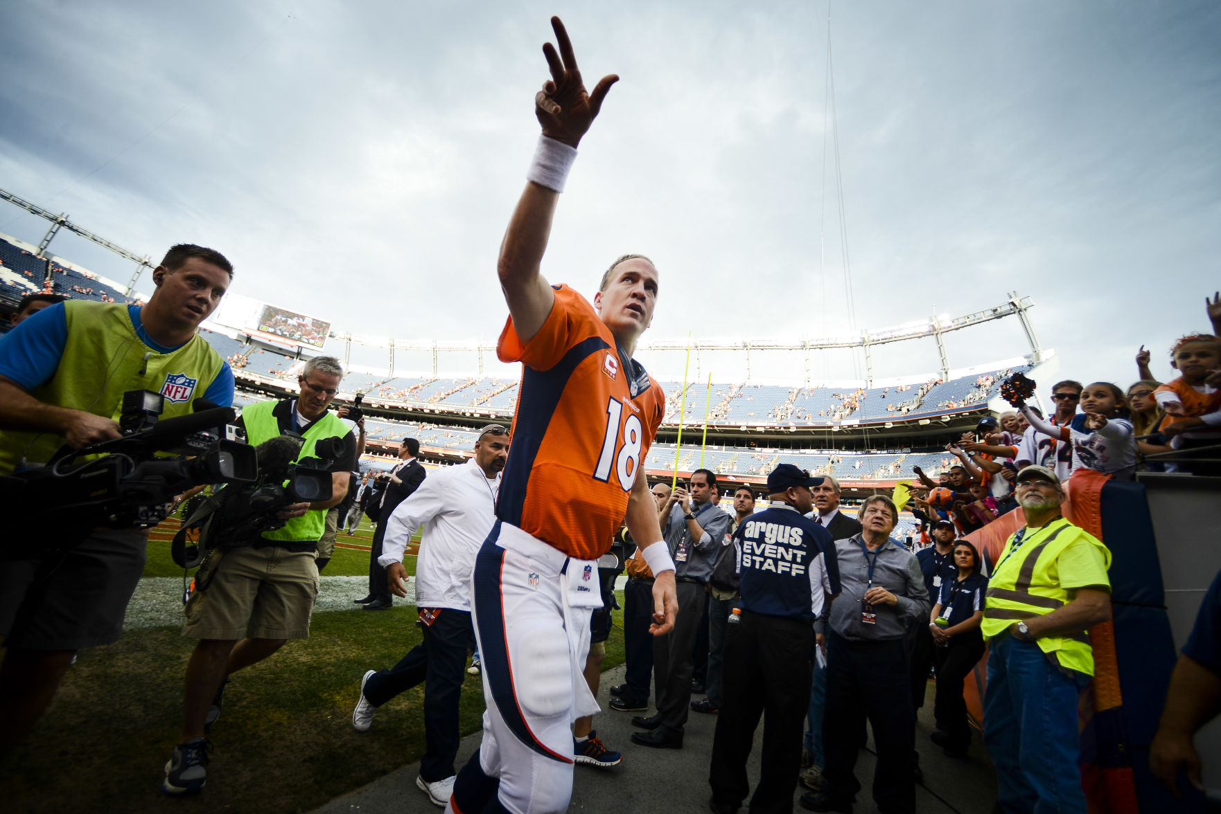Broncos quarterback Peyton Manning celebrates with fans as he heads back to the locker room after the Denver Broncos beat the Philadelphia Eagles 52-20 at Sports Authority Field Sunday, September 29, 2013. Michael Ciaglo, The Gazette (Michael Ciaglo, The Gazette)