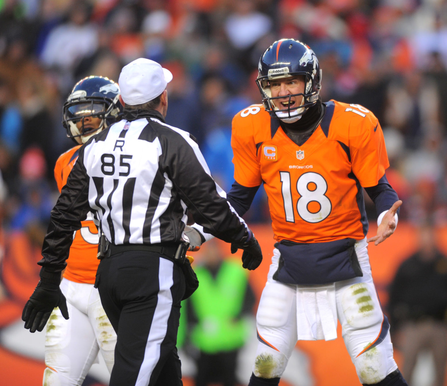 Broncos' quarterback Peyton Manning argues a point with referee Ed Hochuli during Denver's 38-3 win over the Chiefs Sunday, December 30, 2012 at Sports Authority Field at Mile High. Photo by Mark Reis, The Gazette (MARK REIS, THE GAZETTE)