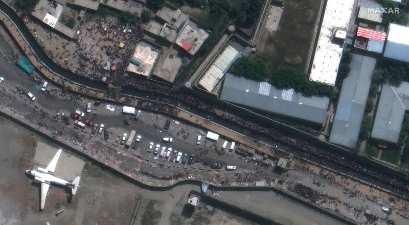 A close-up of crowds near the Abbey Gate at Hamid Karzai International Airport, in Kabul, Afghanistan August 23, 2021, in this satellite image obtained by Reuters on August 26, 2021. Satellite image 2021 Maxar Technologies/Handout via REUTERS (MAXAR TECHNOLOGIES)