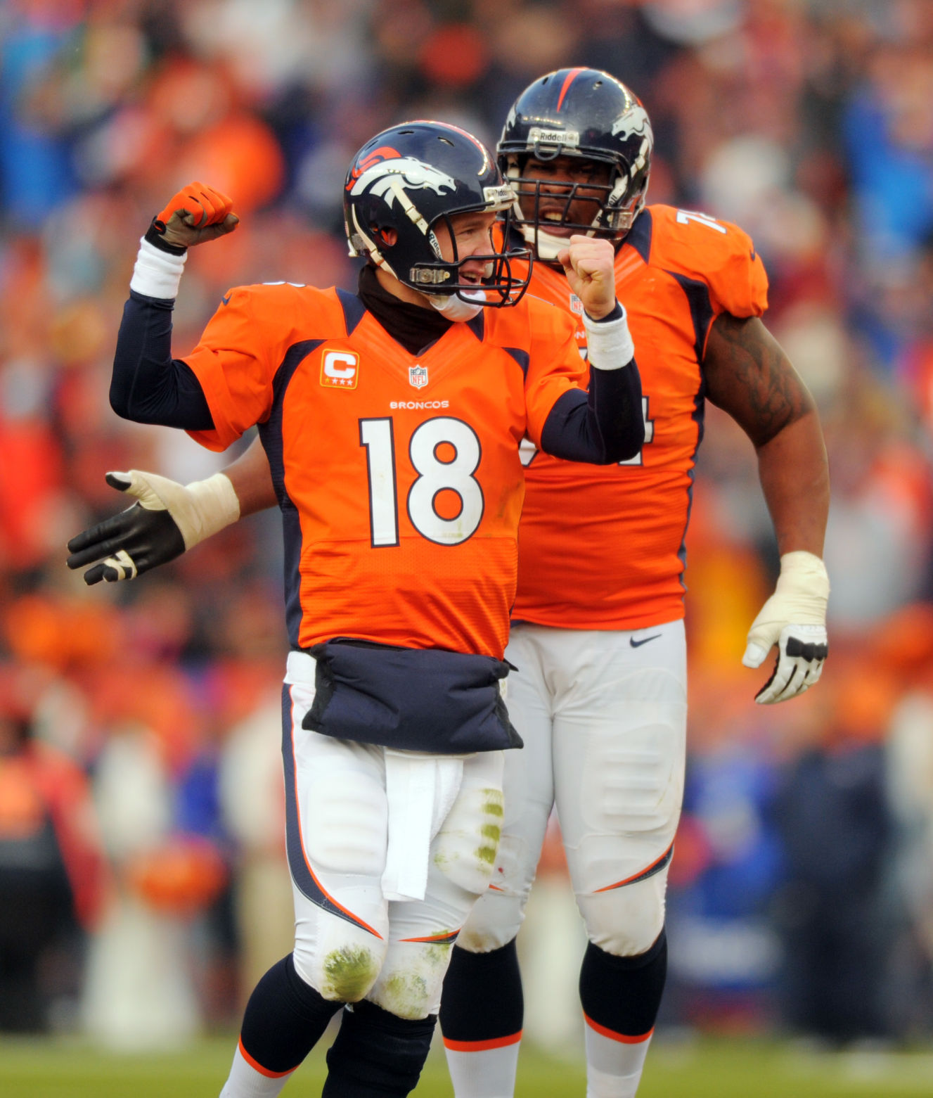 Broncos' quarterback Peyton Manning and tackle Orlando Franklin celebrate Mannning's 16 yard touchdown pass to Eric Decker in the second quarter of Denver's 38-3 win over the Chiefs Sunday, December 30, 2012 at Sports Authority Field at Mile High. Photo by Mark Reis, The Gazette (MARK REIS, THE GAZETTE)