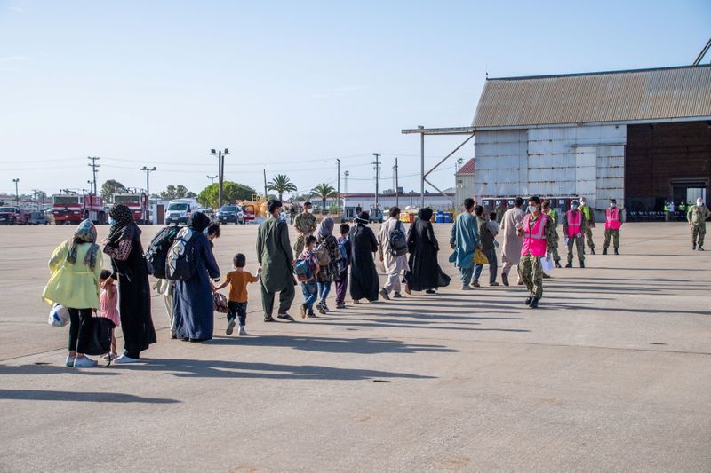 Evacuees from Afghanistan arrive for processing at Naval Station Rota, Spain August 27, 2021. U.S. Navy/Mass Communication Specialist 1st Class Nathan Carpenter/Handout via REUTERS (US NAVY)