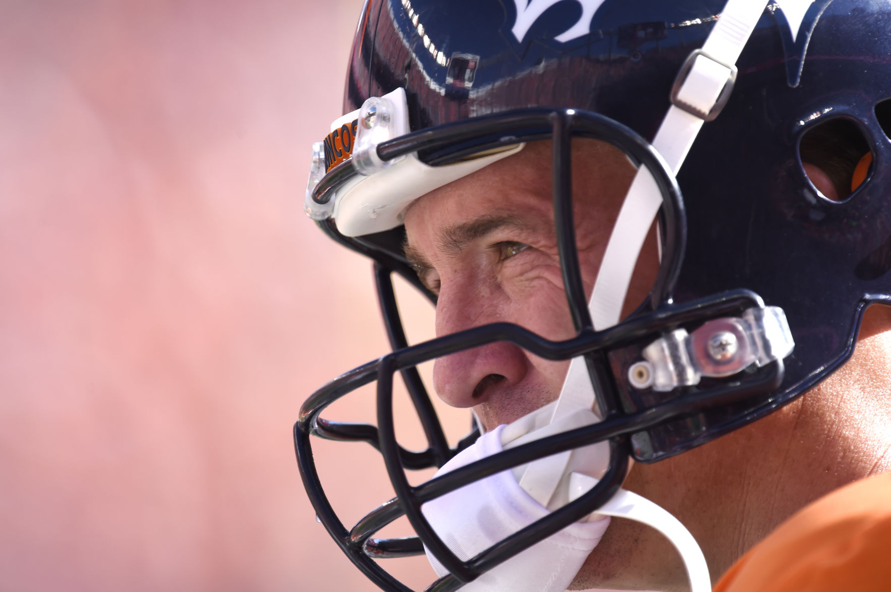 Peyton Manning waits to take the offense back on the field in the first half of Denver's 41-20 win over the Cardinals Sunday, October 5, 2014 at Sports Authority Field at Mile High. Photo by Mark Reis, The Gazette (MARK REIS)