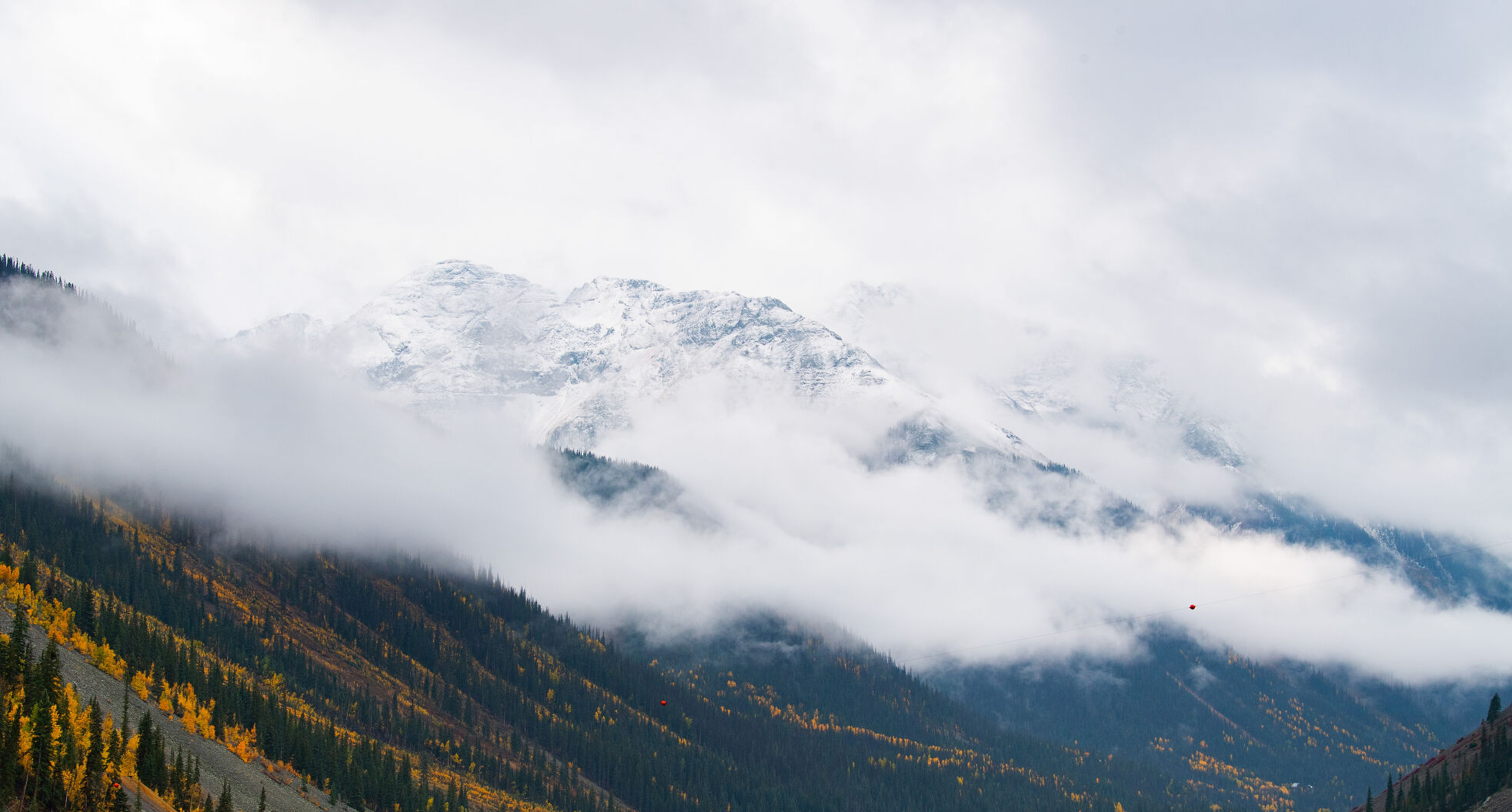 The snow-capped mountains outside Silverton, Colo., peek through the clouds on a wet fall day Wednesday, Sept. 29, 2021. (The Gazette, Christian Murdock) (Christian Murdock/The Gazette)
