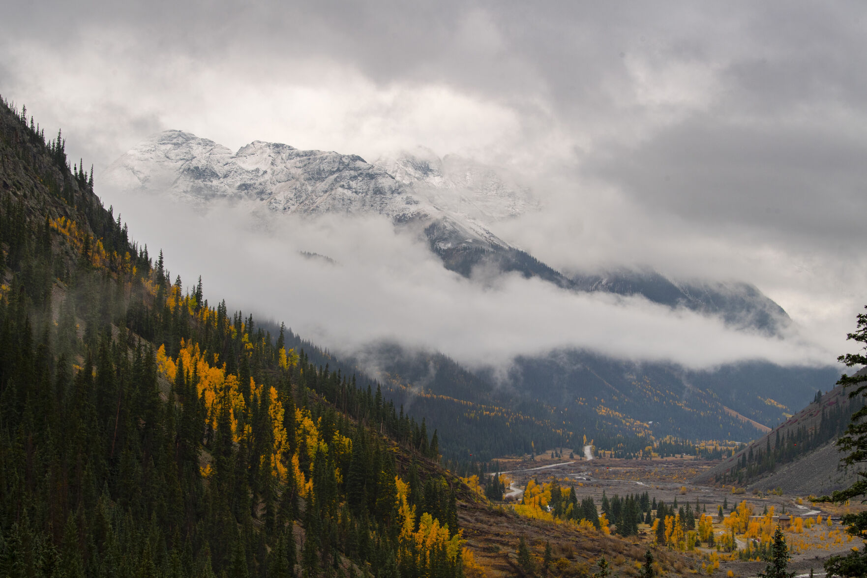 The snow-capped mountains outside Silverton, Colo., peek through the clouds on a wet fall day Wednesday, Sept. 29, 2021. (The Gazette, Christian Murdock) (Christian Murdock/The Gazette)