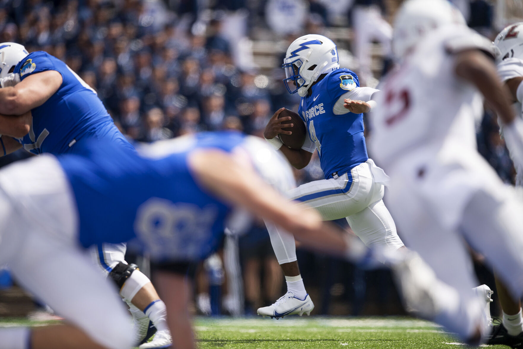Air Force quarterback Haaziq Daniels (4) carries the ball during the Air Force Falcons home football game against the Lafayette Leopards at Falcon Stadium at the United States Air Force Academy in Colorado Springs, Colo. on Sept. 4, 2021. The Air Force Falcons won the game against the Lafayette Leopards by a score of 35-14. (Chancey Bush/ The Gazette) (Chancey Bush/ The Gazette)