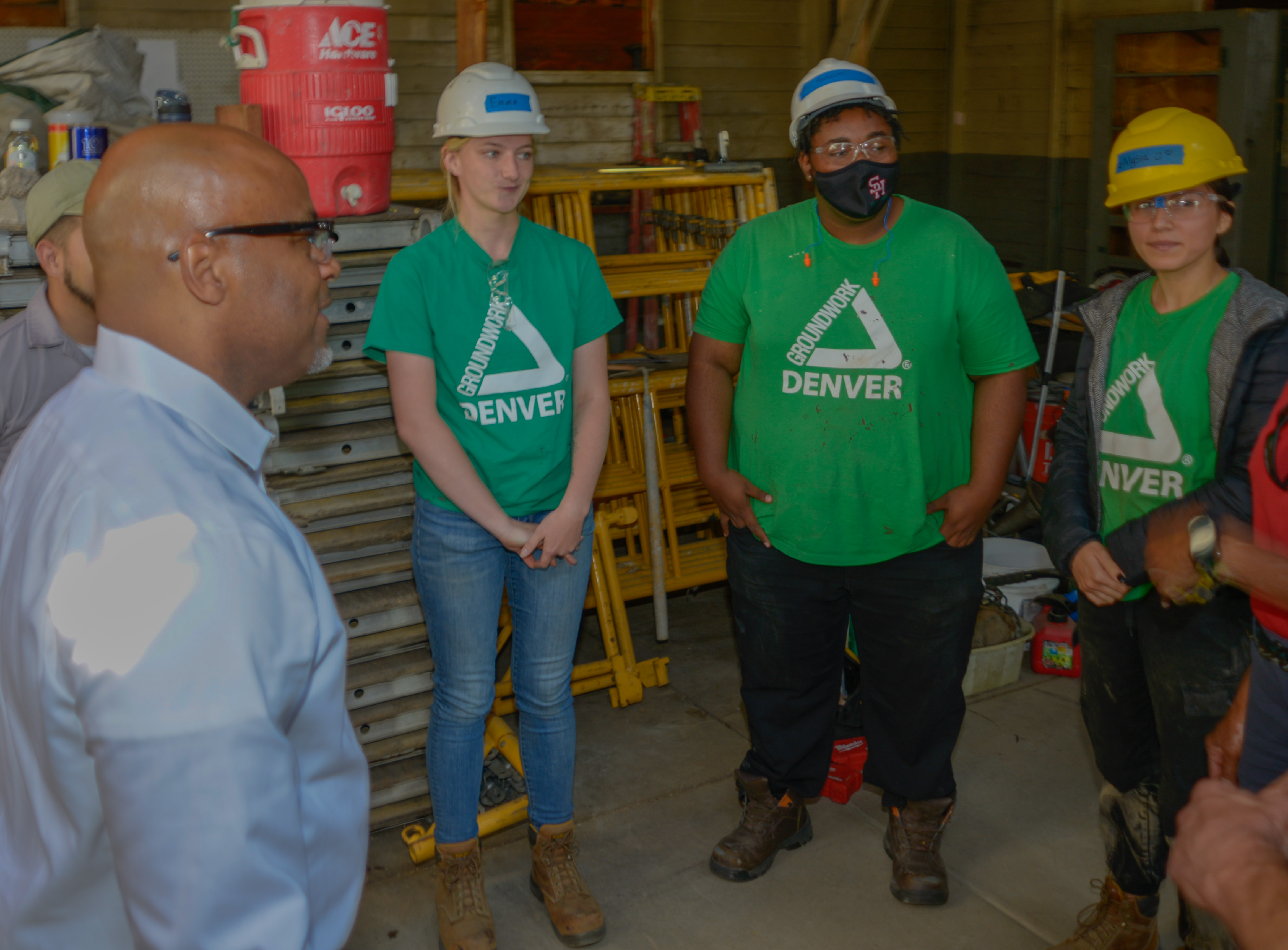 Denver Mayor Michael Hancock meets with the first cohort of workers in his Workforce Historic Preservation Training ProgramL to R; Mayor Hancock, Emma Williams, Kareem Soldana and Alysia Salazar