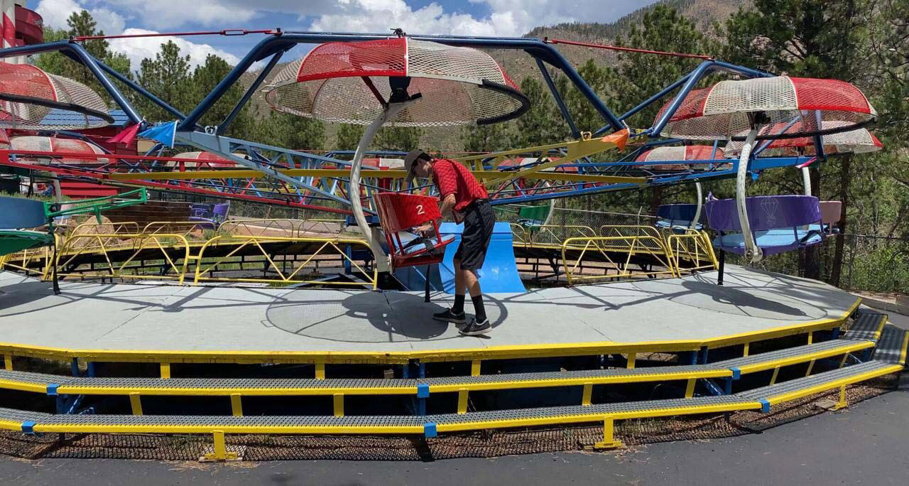 Marc Ionita prepares a ride at The North Pole — Santa’s Workshop on Monday. The attraction has been having trouble finding staff and has had to close two days of the week during a time when it would normally be open seven days a week. (The Gazette, Jerilee Bennett)