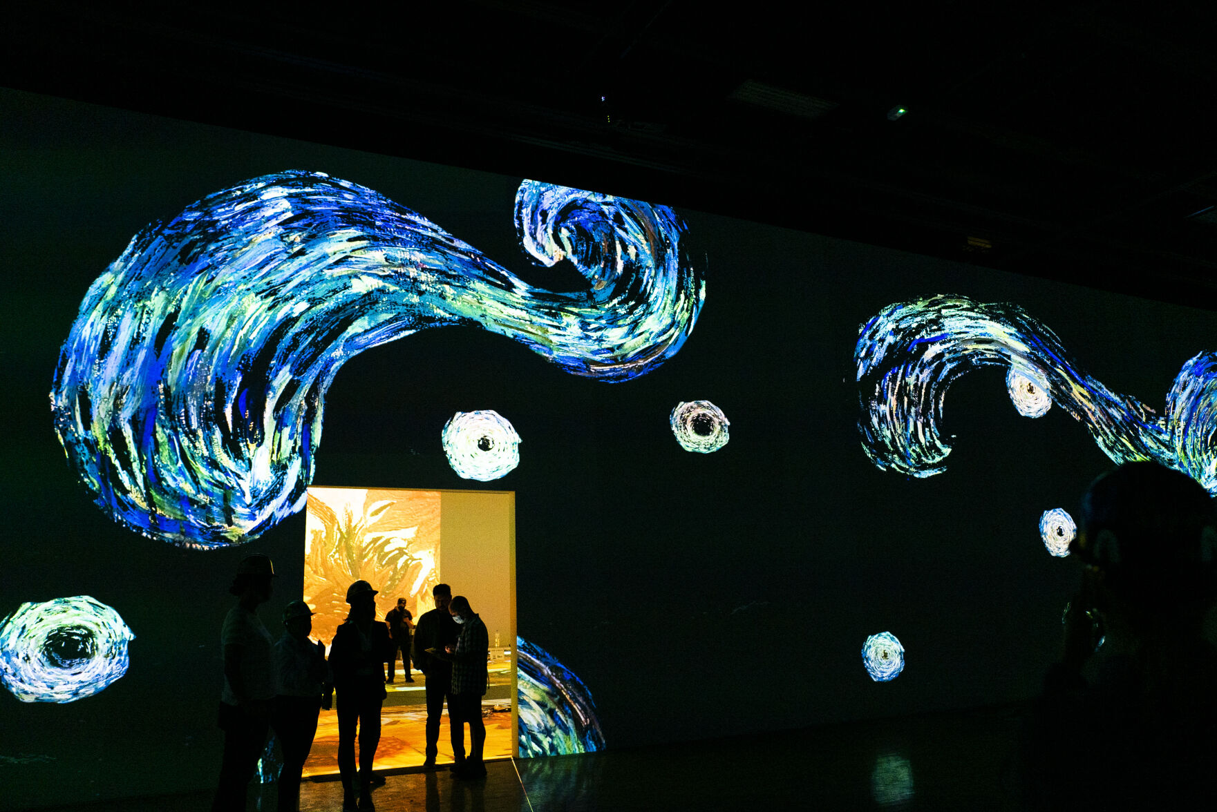 Guests experience a 10 minute example of the immersive experience during a hard hat tour of the new Immersive Van Gogh Exhibit Denver at Lighthouse Denver, just west of the River North Art District on Wednesday, September 22, 2021. (Photo by Katie Klann/Denver Gazette) (Katie Klann The Gazette)