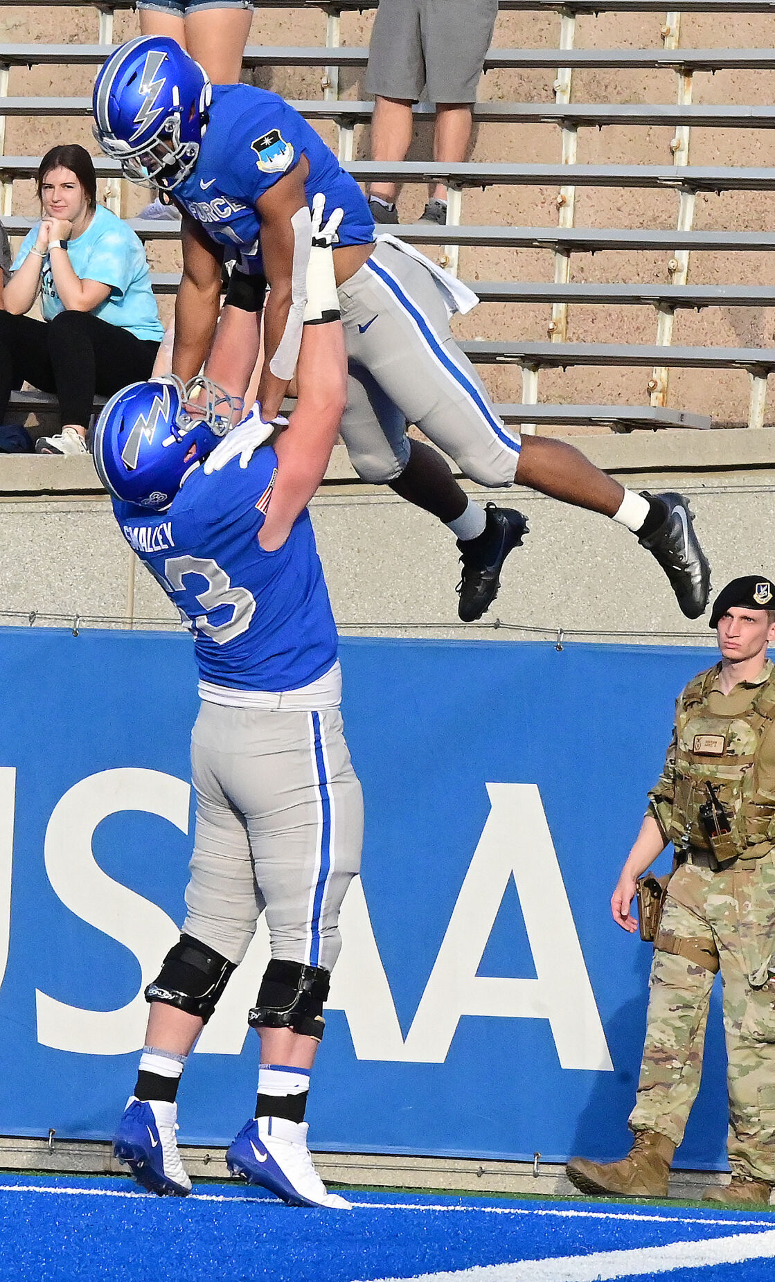 Air Force wide receiver Micah Davis gets lifted up by Air Force Everett Smalley after Davis got his first touchdown of a game at Falcon Stadium in Colorado Springs, Colorado on Saturday, Sept. 18, 2021 He threw an interception in the end zone on the next play. Air Force lost the heartbreaker 49-45. (Photo by Jerilee Bennett, The Gazette) (JERILEE BENNETT, THE GAZETTE)