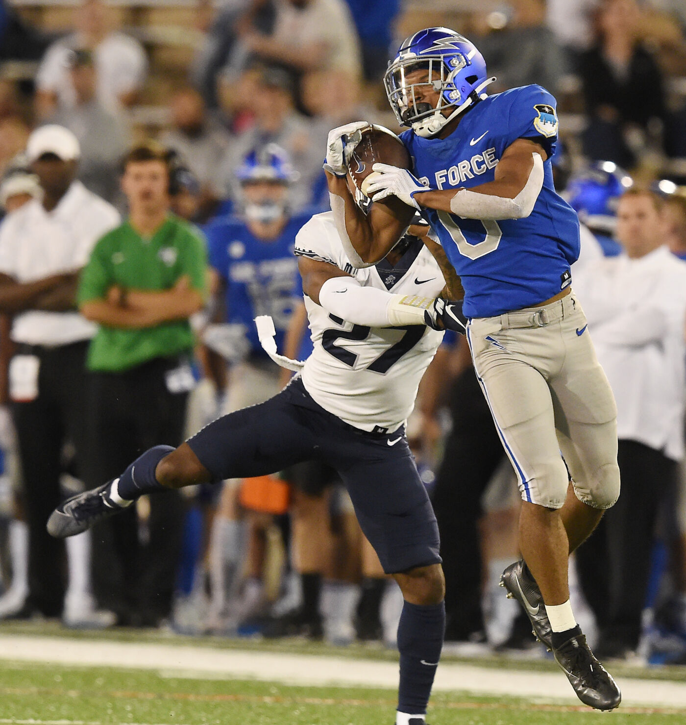 Air Force wide receiver Micah Davis pulls in a catch while being defended by Utah State defender Hunter Reynolds in the fourth quarter of a game at Falcon Stadium in Colorado Springs, Colorado on Saturday, Sept. 18, 2021 He threw an interception in the end zone on the next play. Air Force lost the heartbreaker 49-45. (Photo by Jerilee Bennett, The Gazette) (JERILEE BENNETT, THE GAZETTE)