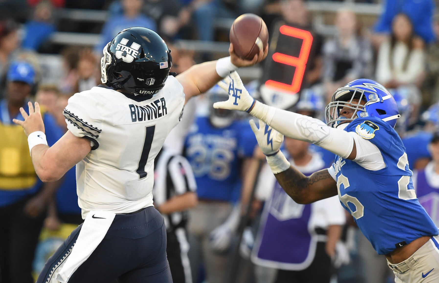 Utah State quarterback LoganBonner is pressured by Air Force linebacker Vince Sanford in the second quarter of a game at Falcon Stadium in Colorado Springs, Colorado on Saturday, Sept. 18, 2021. (Photo by Jerilee Bennett, The Gazette) (JERILEE BENNETT, THE GAZETTE)