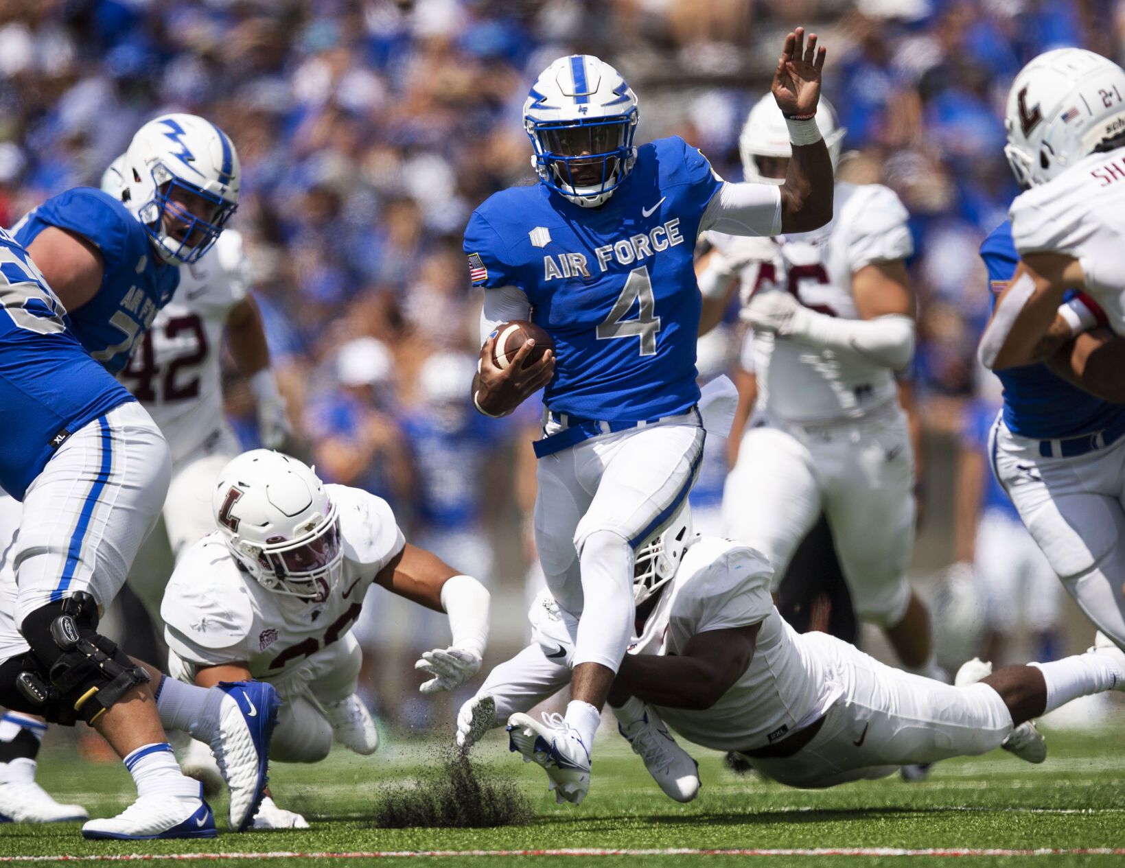 Air Force quarterback Haaziq Daniels (4) carries the ball during the Air Force Falcons' home football game against the Lafayette Leopards at Falcon Stadium at the Air Force Academy in Colorado Springs on Sept. 4, 2021. The Air Force Falcons won the game against the Lafayette Leopards by a score of 35-14. (Chancey Bush/ The Gazette) (Chancey Bush/ The Gazette)