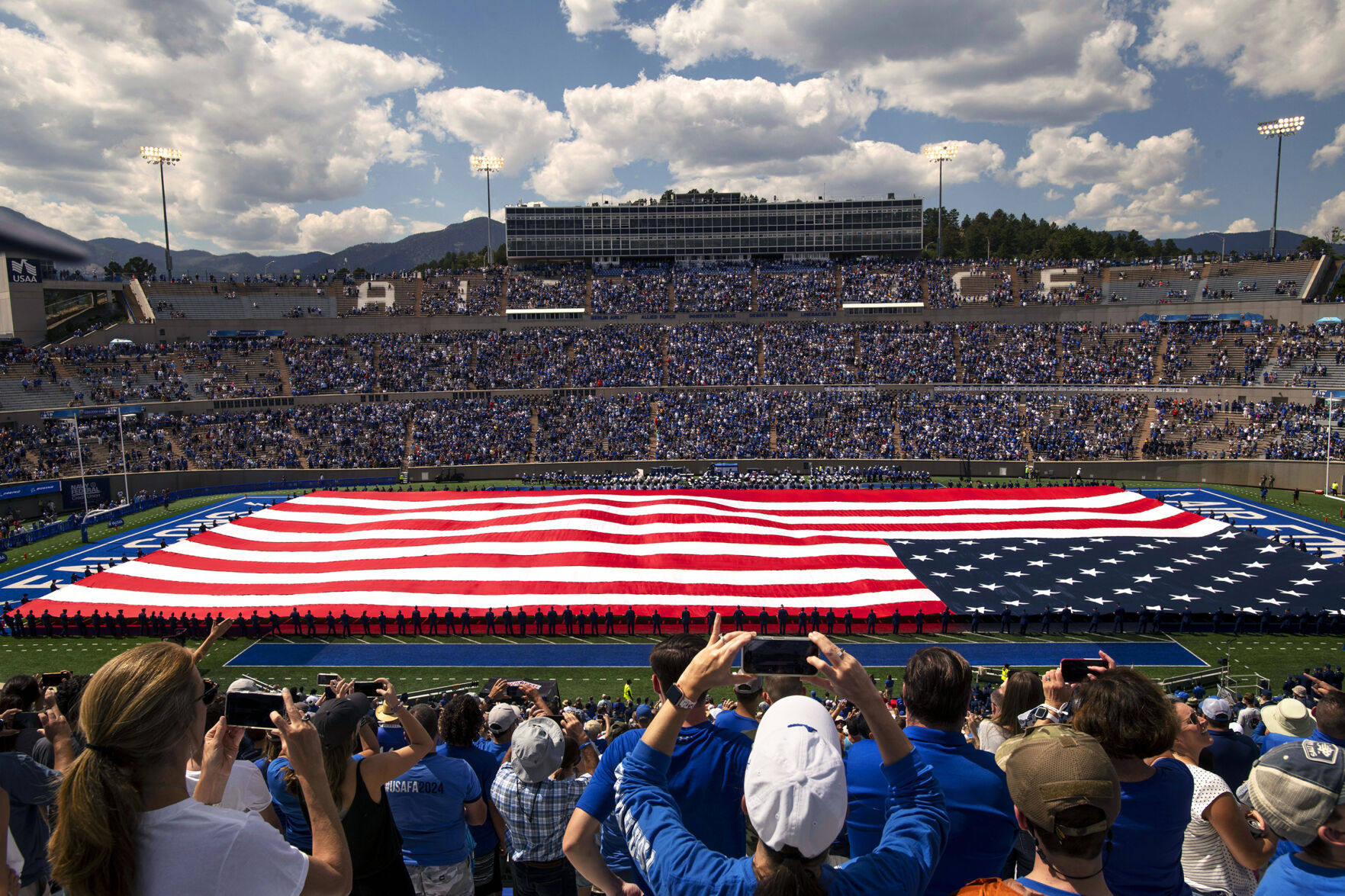Cadets hold a field length American flag during half time at the Air Force home football game against the Lafayette Leopards at Falcon Stadium at the United States Air Force Academy in Colorado Springs, Colo. on Sept. 4, 2021. Around 30,000 fans were in attendance of the game. Last season no fans were allowed due to the COVID-19 pandemic. The Air Force Falcons won the game against the Lafayette Leopards by a score of 35-14. (Chancey Bush/ The Gazette) (Chancey Bush/ The Gazette)