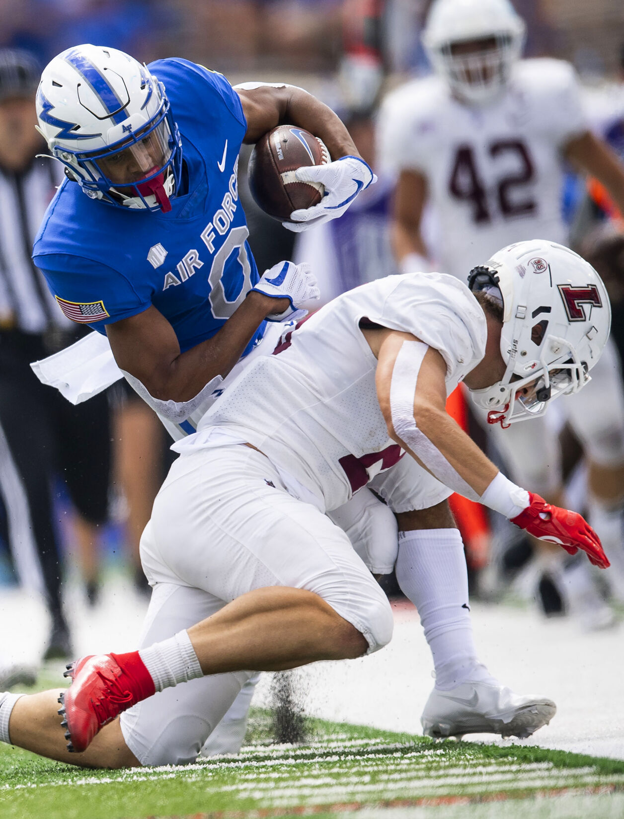 Air Force wide receiver Micah Davis (0) gets pushed out of bounds against the Lafayette Leopards at Falcon Stadium at the United States Air Force Academy in Colorado Springs, Colo. on Sept. 4, 2021. The Air Force Falcons won the game against the Lafayette Leopards by a score of 35-14. (Chancey Bush/ The Gazette) (Chancey Bush/ The Gazette)