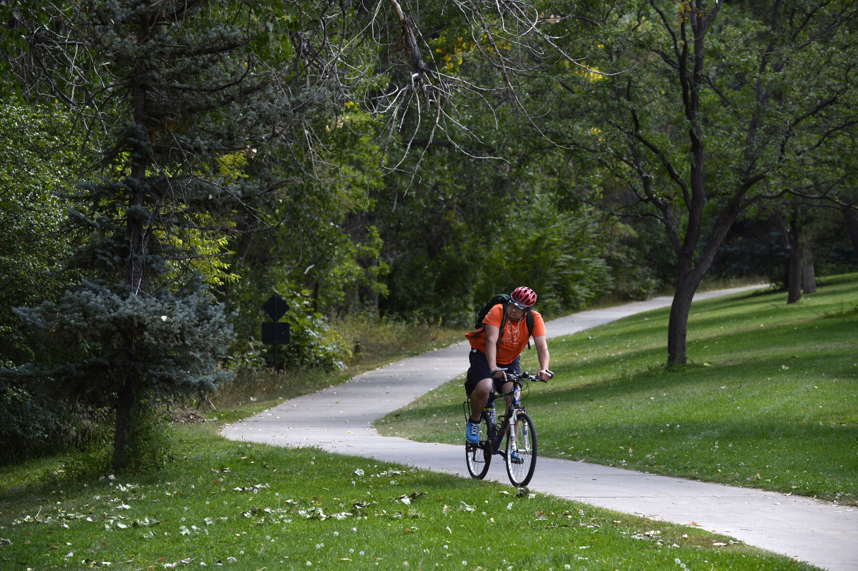 A cyclist uses the bike path along the South Platte River at Grant-Frontier Park on September 11, 2021 in Denver, Colorado. (Kathryn Scott)