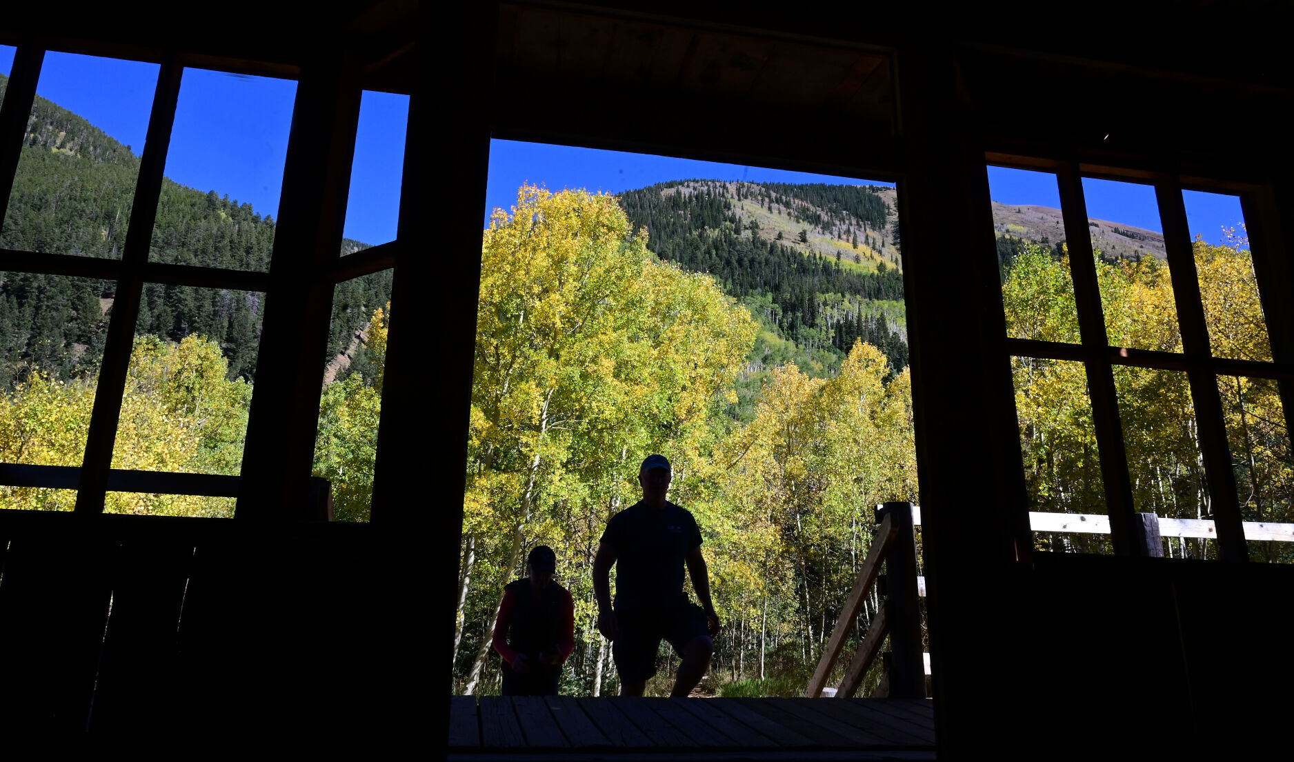 Morgan and Chere Garvey from Highlands Ranch enter the Bird House Hotel in the ghost town of Ashcroft on Wednesday, Sept. 22, 2021. In 1883, Ashcroft, Colorado was a town with a population of perhaps 2,000 with two newspapers, a school, sawmills, a small smelter, and 20 saloons—bigger than Aspen at the time. Ashcroft is 11 miles south of Aspen on Castle Creek Rd. (Photo by Jerilee Bennett, The Gazette) (Jerilee Bennett)