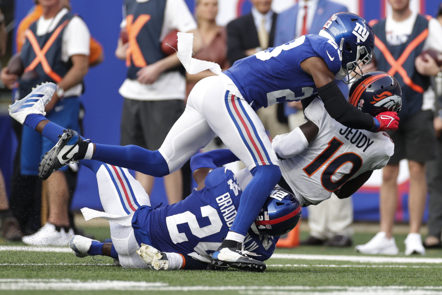 Denver Broncos wide receiver Jerry Jeudy (10) is tackled by New York Giants' Logan Ryan (23) and James Bradberry (24) during the second half of an NFL game Sunday, Sept. 12, 2021, in East Rutherford, N.J. (AP Photo/Adam Hunger) (Adam Hunger)